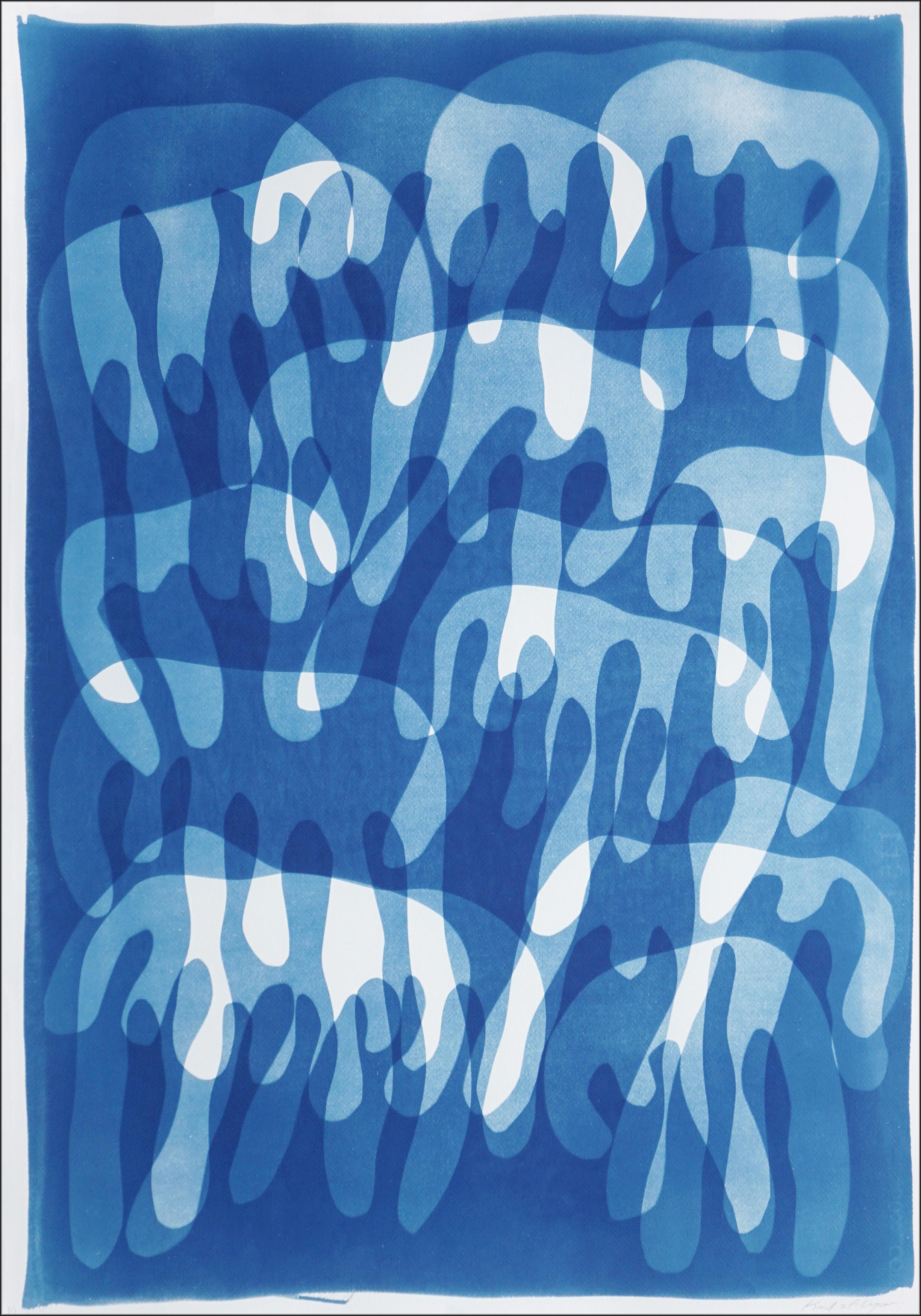 This unique monotype cyanotype, rendered in rich blue tones, invites the viewer into a dreamlike rhythm of interwoven shapes. Created using the cyanotype process, this one-of-a-kind monotype features rich, layered blues contrasted by striking white