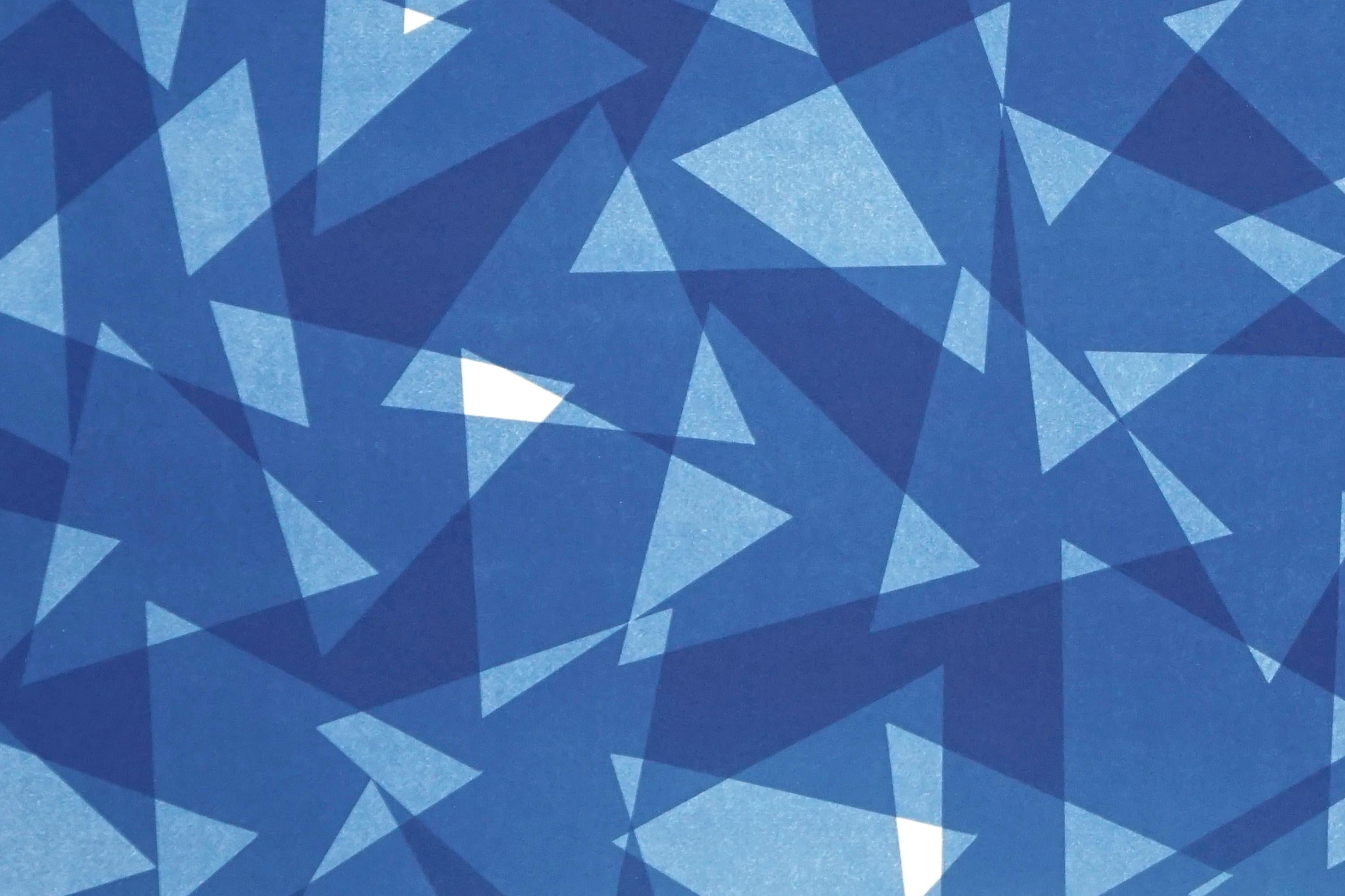 This is an exclusive handprinted unique cyanotype that takes its inspiration from the mid-century modern shapes.
It's made by layering paper cutouts and different exposures using uv-light. 

Details:
+ Title: Transparent Layered Triangles I
+ Year: