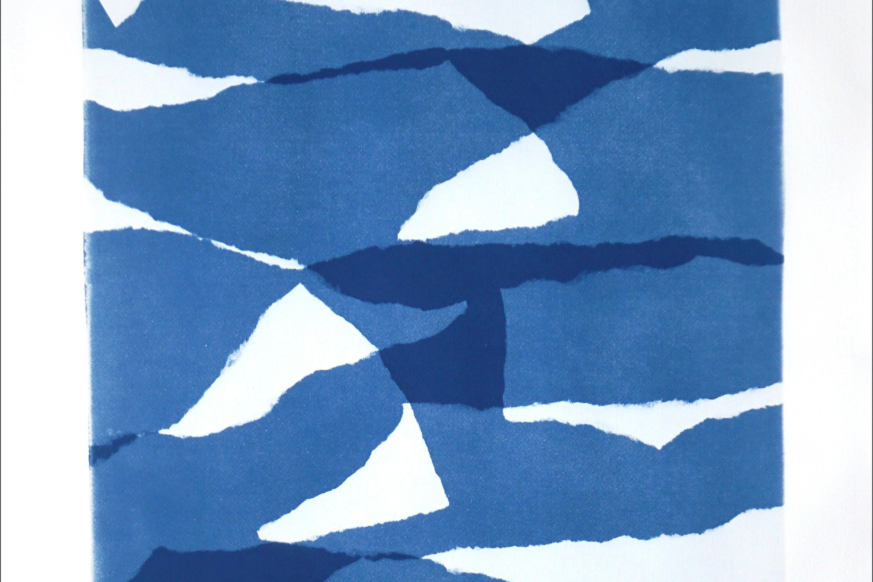 This is an exclusive handprinted unique cyanotype that takes its inspiration from the mid-century modern shapes.
It's made by layering paper cutouts and different exposures using uv-light. 

Details:
+ Title: Layered Torn Paper II
+ Year: 2022
+
