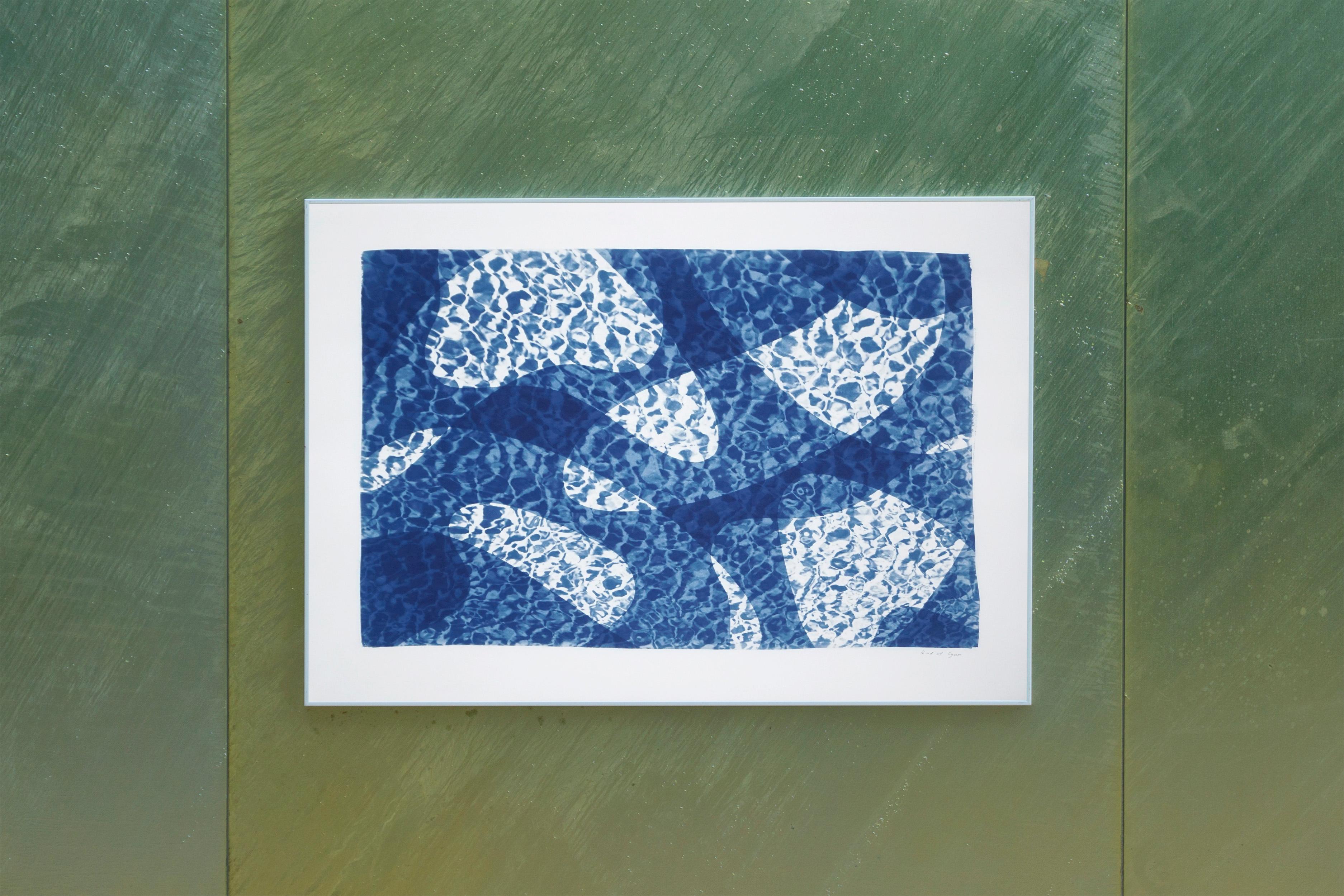 This is an exclusive handprinted unique cyanotype that takes its inspiration from the mid-century modern shapes.
It's made by layering paper cutouts and different exposures using uv-light. 

Details:
+ Title: Fish Swimming Below Water II
+ Year: