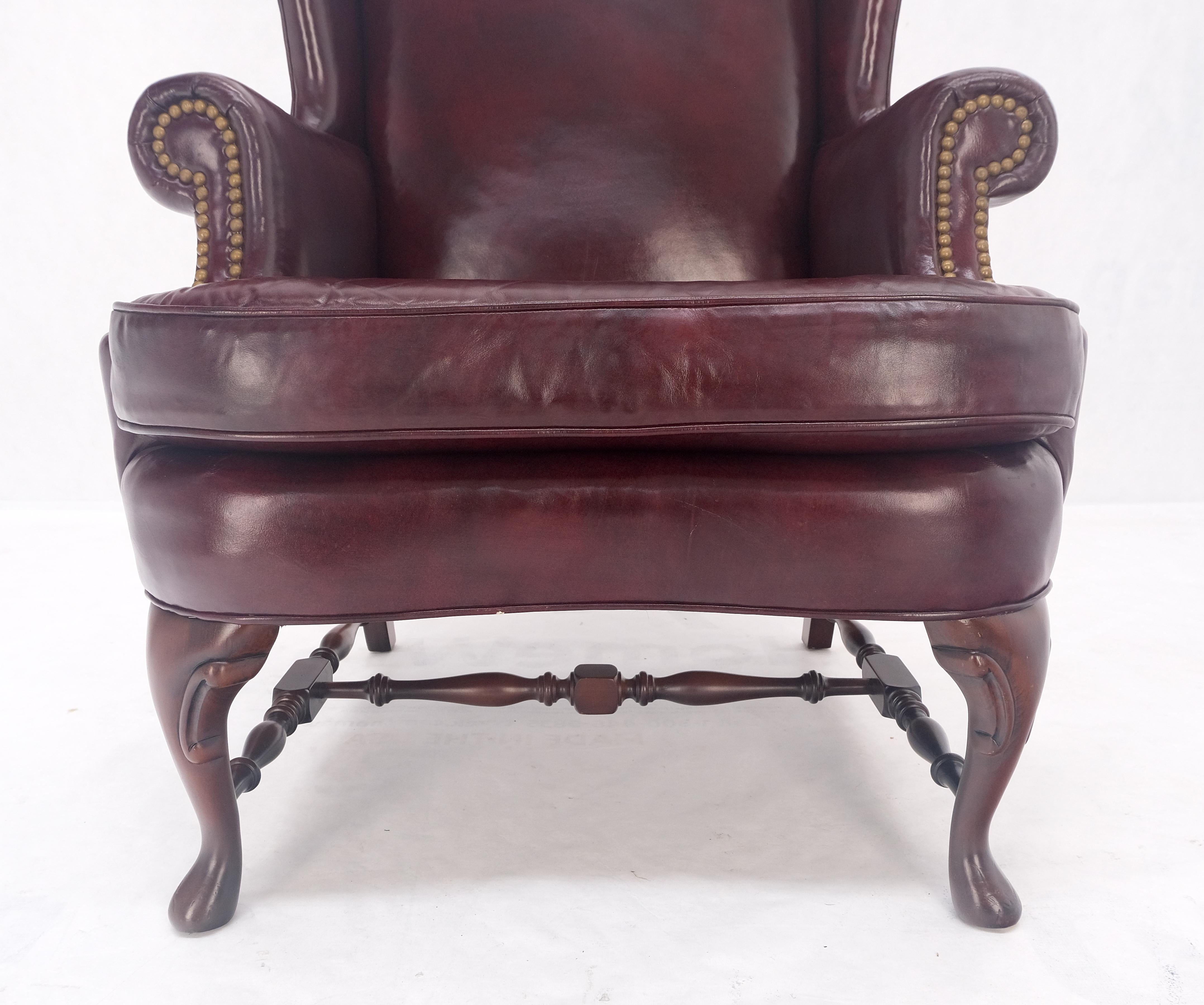 American Kindel Burgundy Leather Upholstery Carved Mahogany Legs Wingback Chair & Ottoman For Sale