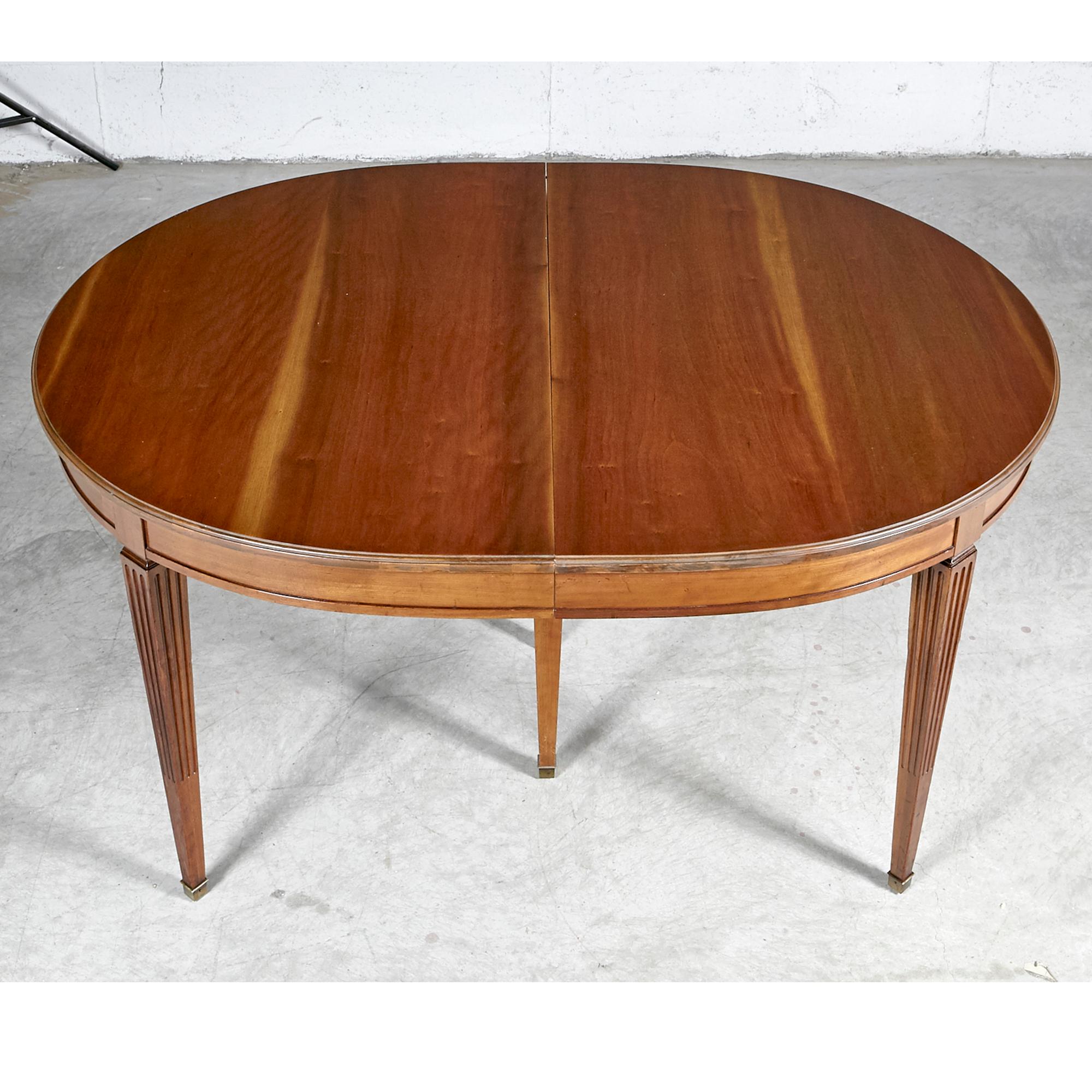 Vintage 1950s cherry wood expandable dining room table by Kindel Furniture Co. The table comes with three extra boards and a center leg for stability. Newly refinished condition. Boards(3): 16