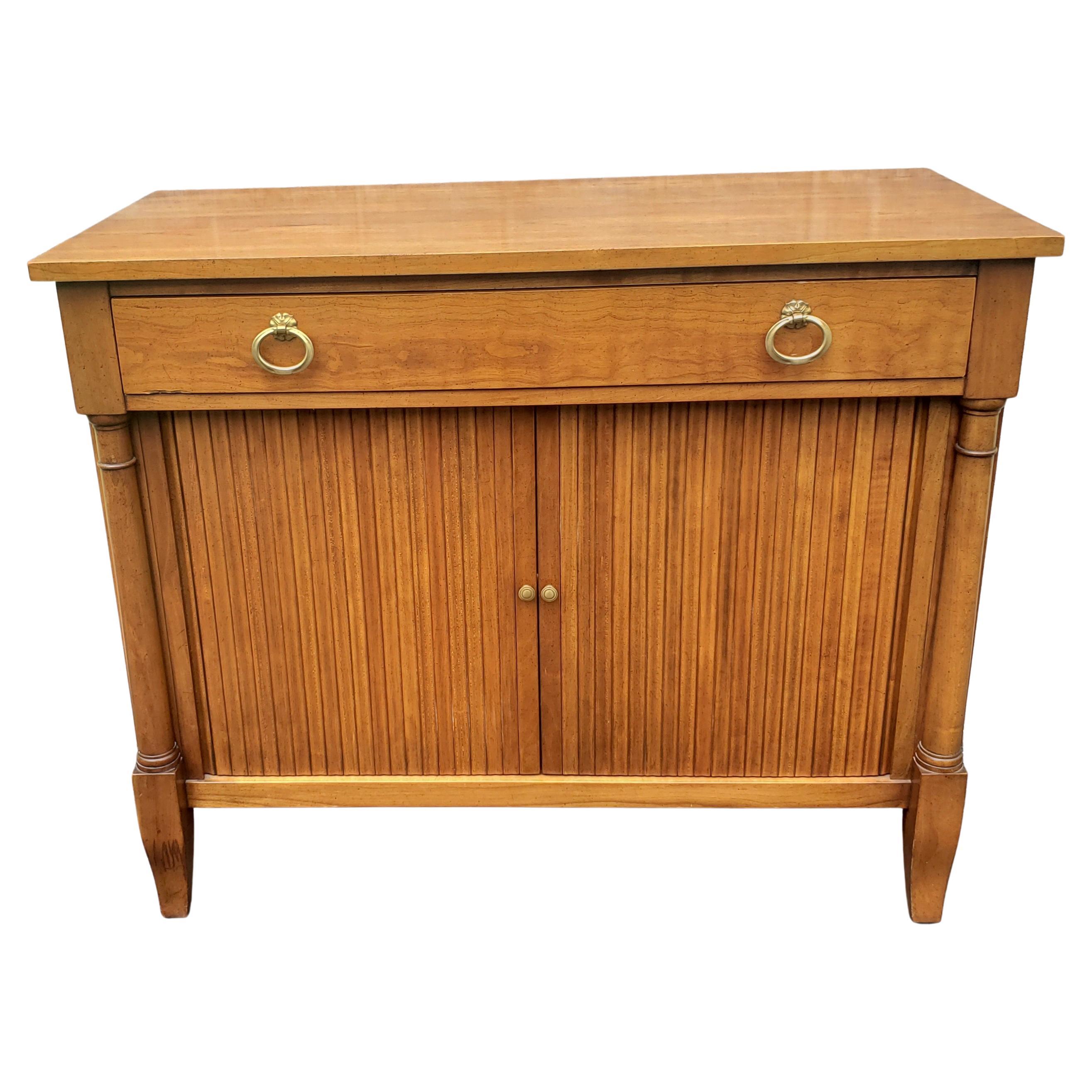 Sweet small buffet cabinet with lots of storage in the Scandinavian Modern style, Belvedere finish is a medium brown. Finish in good shape with light wear appropriate with age and use. 
Measures 39