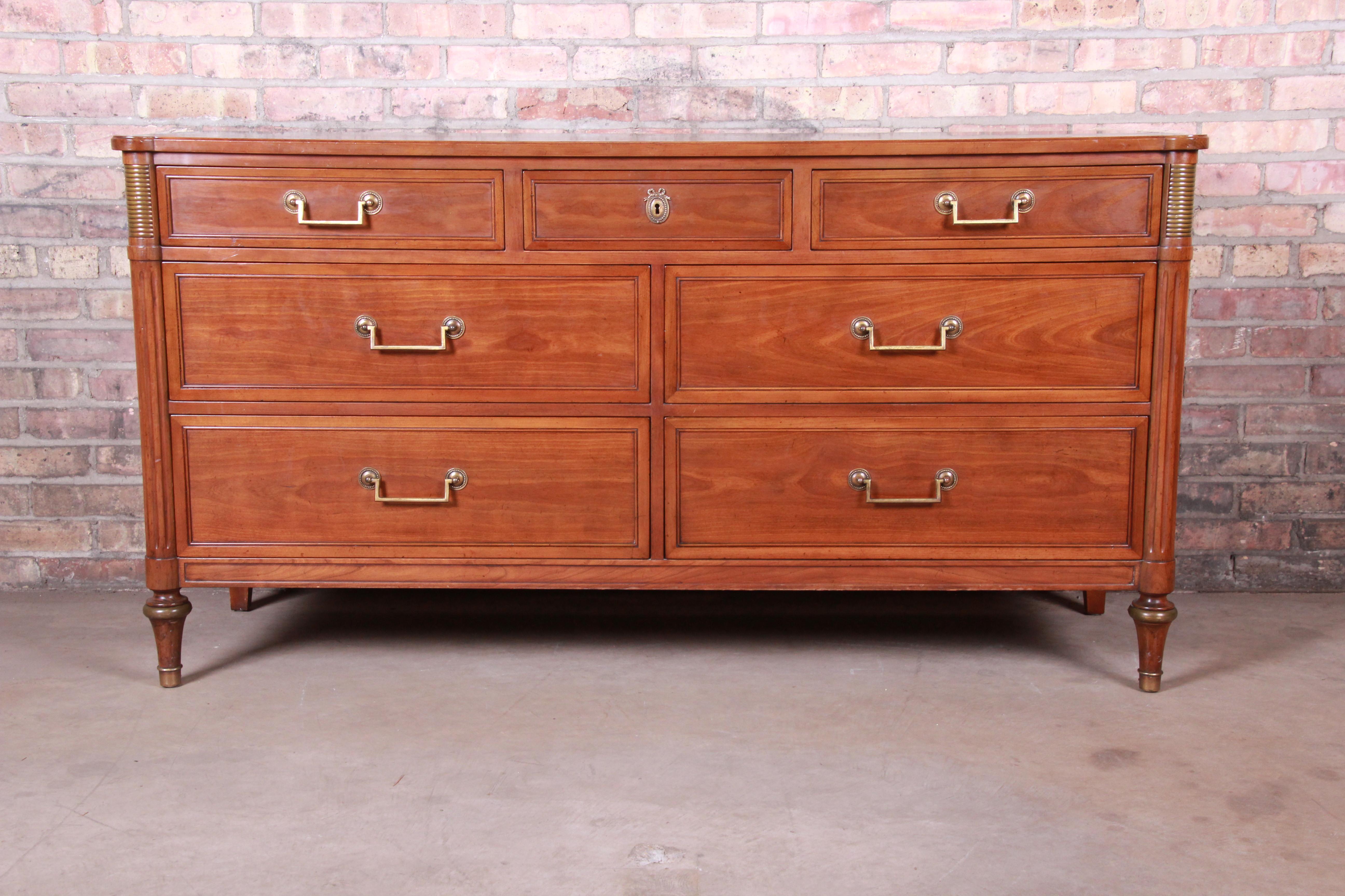 An exceptional French Regency Directoire style seven-drawer dresser or credenza

By Kindel Furniture

USA, circa 1970s

cherrywood, with brass hardware and accents.

Measures: 60.63