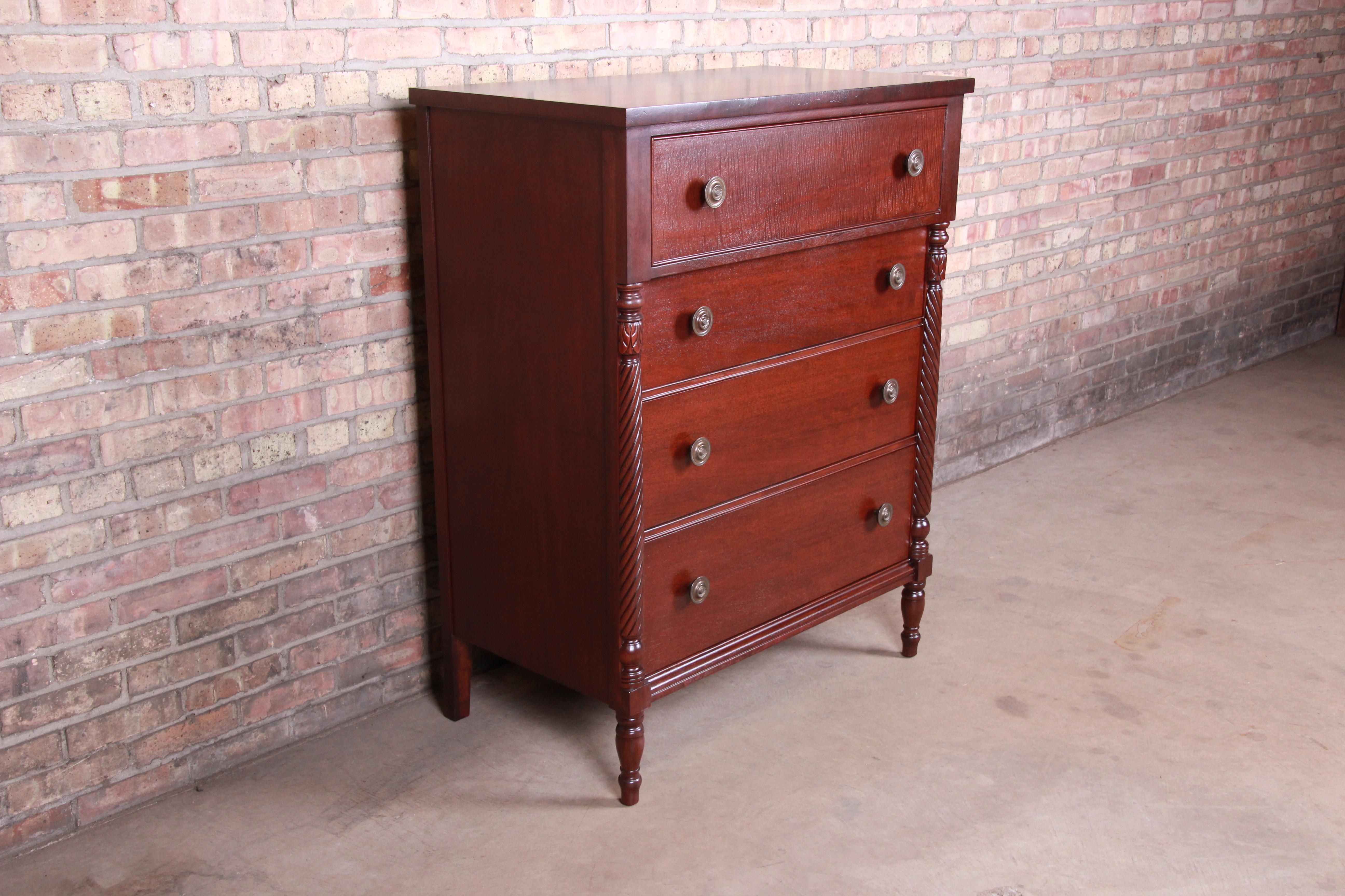 An exceptional American Empire style highboy dresser chest

By Kindel Furniture

USA, circa 1960s

Mahogany, with carved columns, turned legs, and original brass hardware.

Measures: 37.13