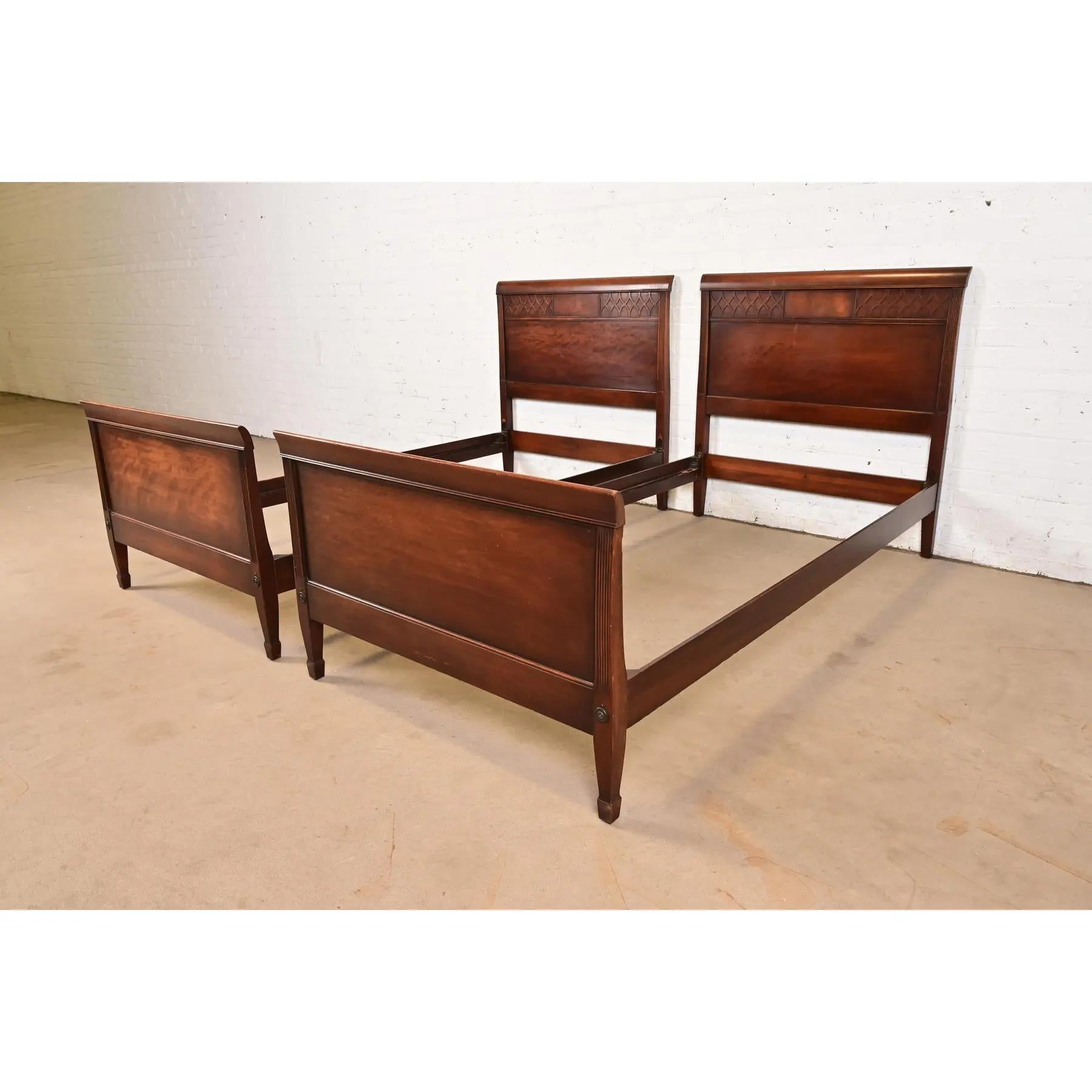 A gorgeous pair of Federal or Regency style carved mahogany twin size beds

By Kindel Furniture

USA, Circa 1960s

Each measures: 39.5