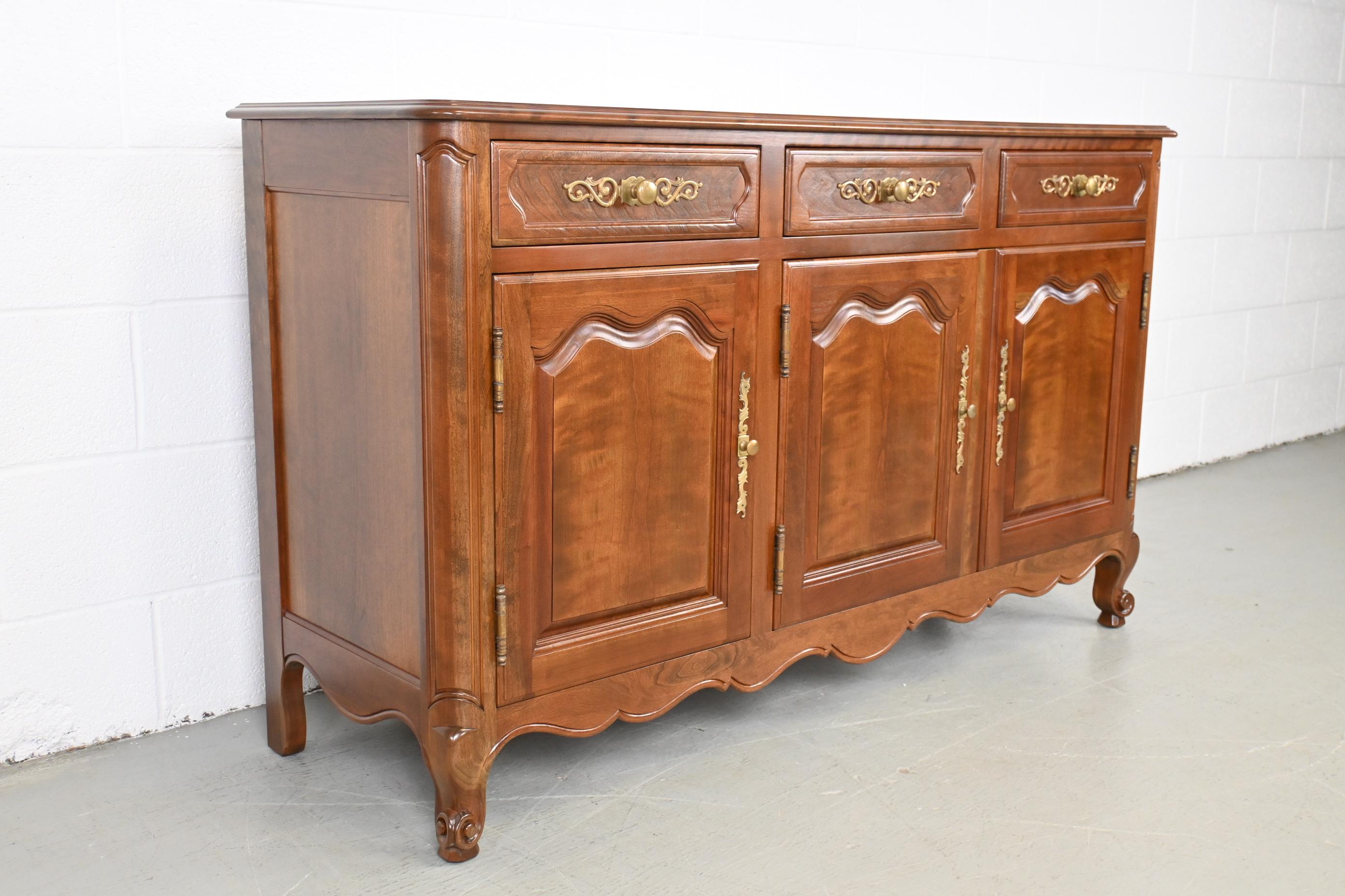 Kindel Furniture French Style Cherry Sideboard or Credenza

Kindel Furniture, USA, 1950s

58 Wide x 19 Deep x 34.25 High

French style cherry sideboard or buffet with three drawers and two adjustable shelves.

Professionally refinished. Excellent