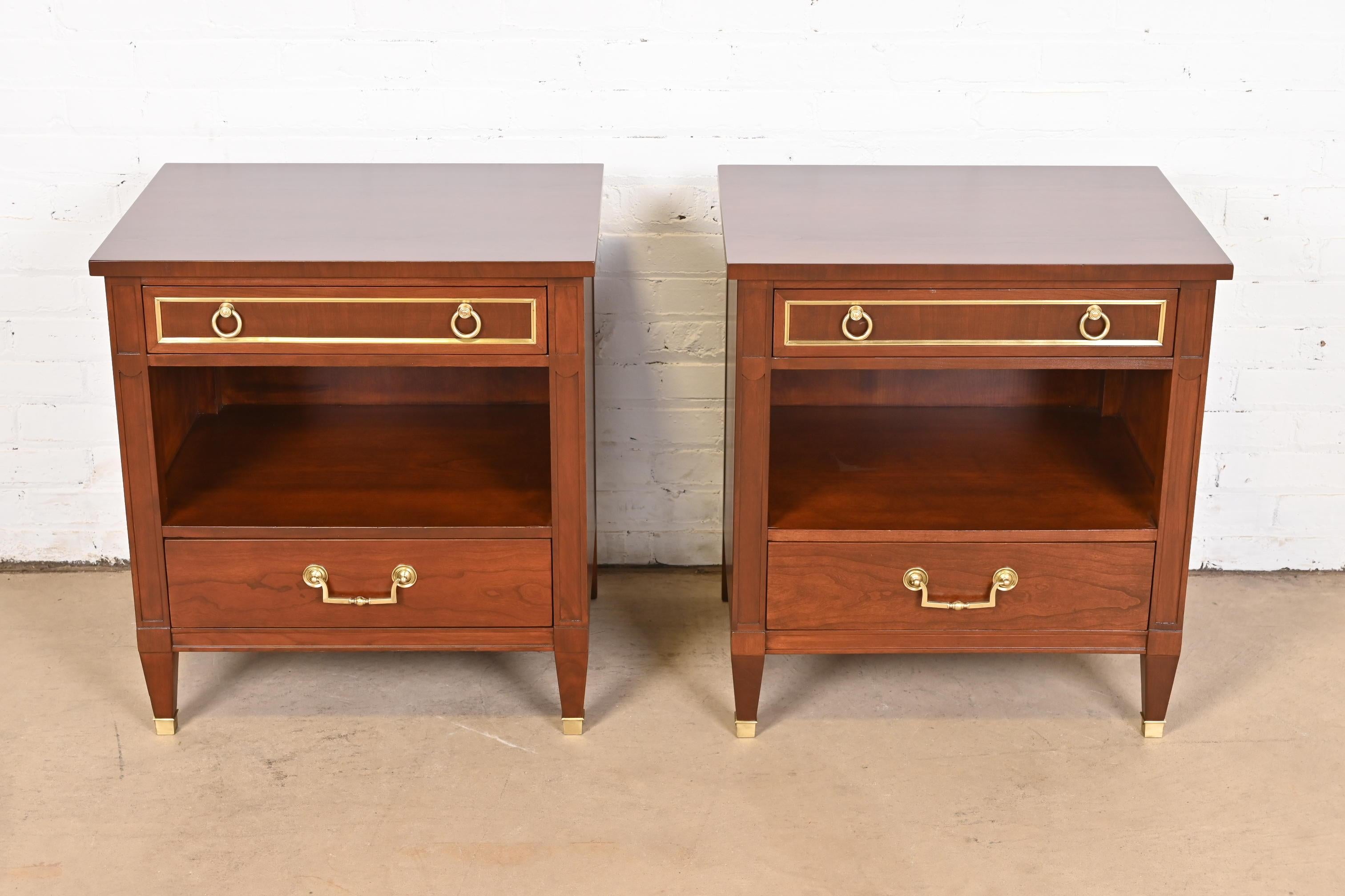 A gorgeous pair of French Regency Louis XVI style bedside tables

By Kindel Furniture

USA, 1960s

Beautiful cherry wood, with original brass hardware and trim.

Measures: 24