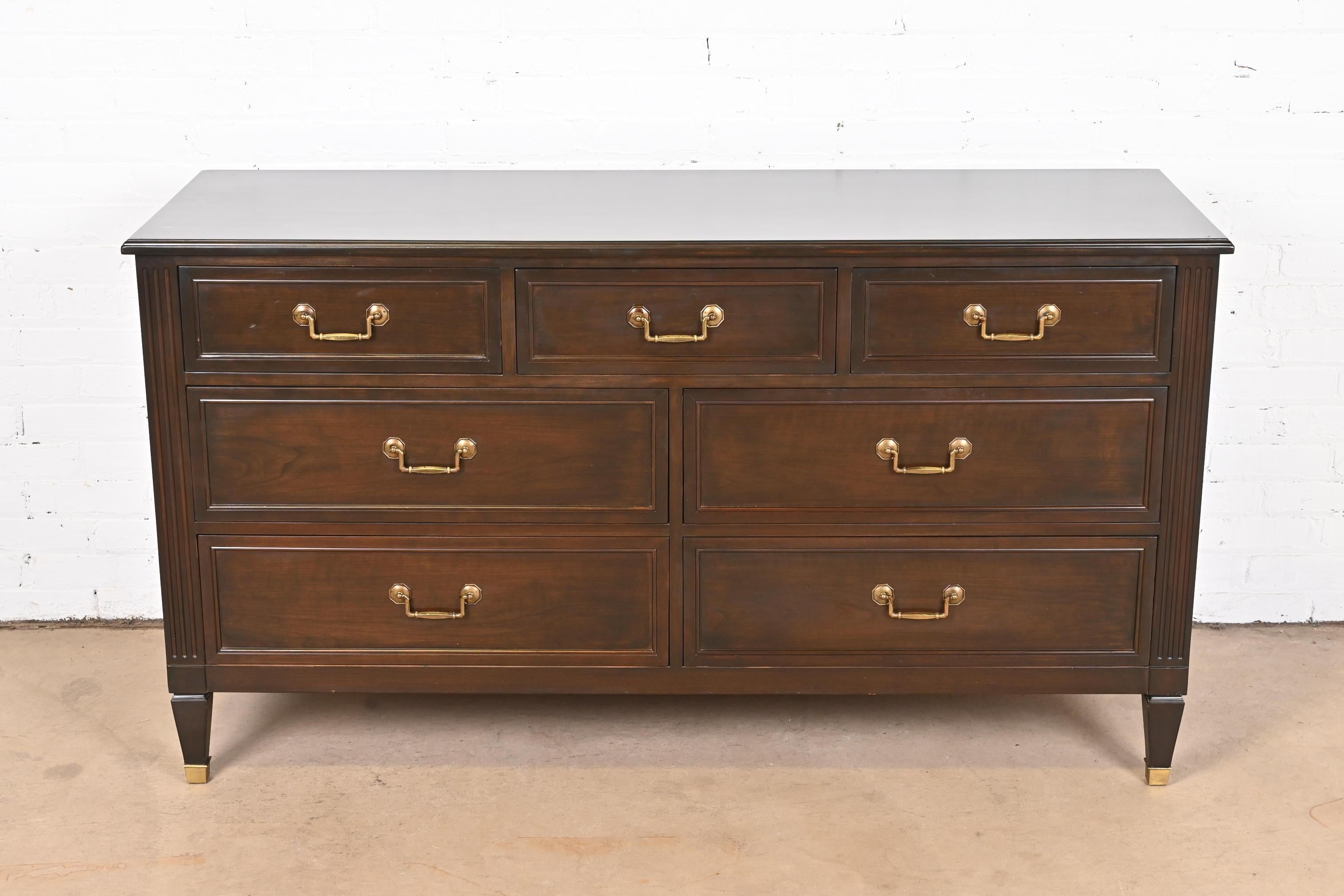 A gorgeous French Regency Louis XVI style seven-drawer dresser or credenza

By Kindel Furniture

USA, Circa 1980s

Cherry wood, with original brass hardware.

Measures: 60