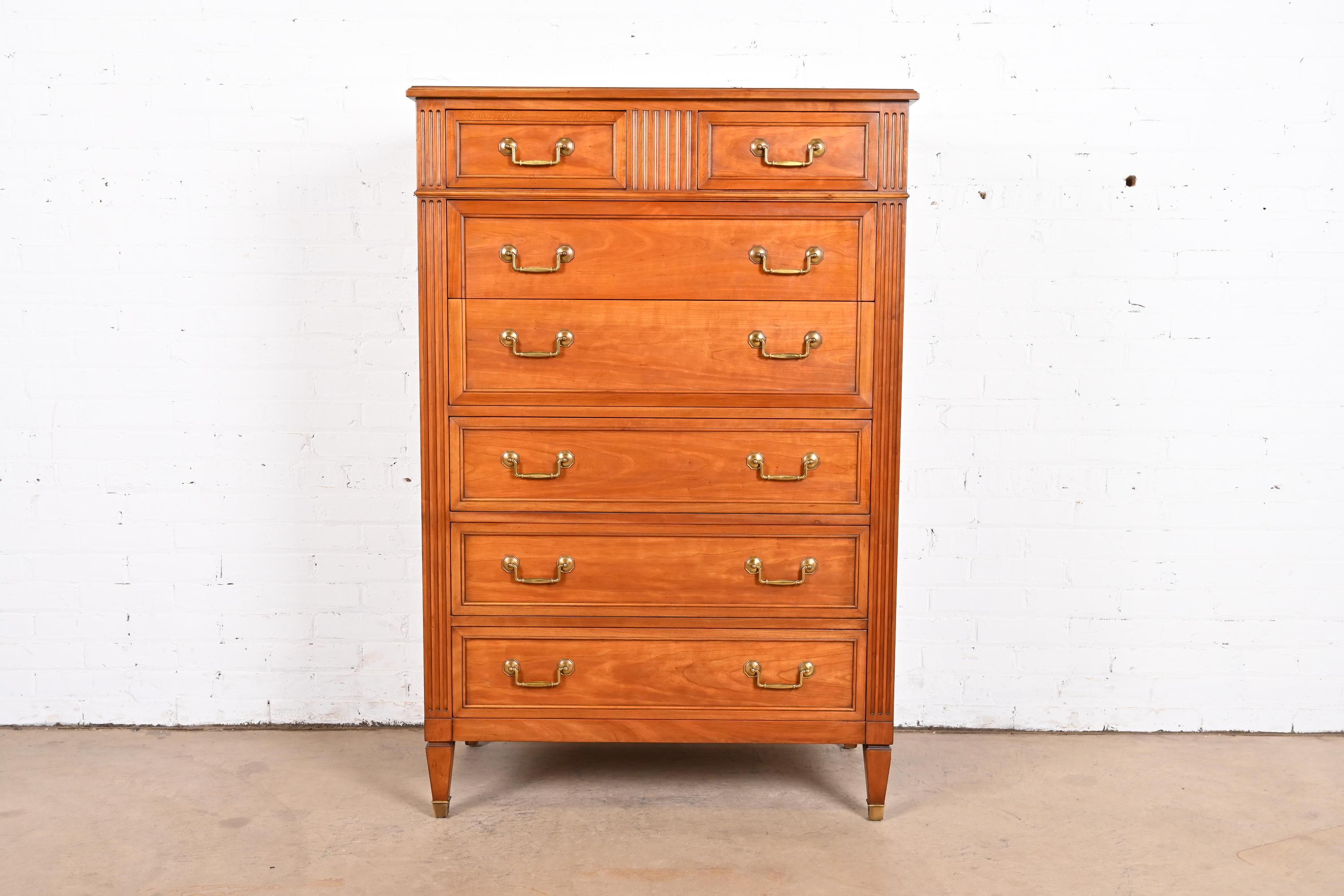 A gorgeous French Regency Louis XVI style seven-drawer chest of drawers or highboy dresser

By Kindel Furniture

USA, Circa 1960s

Carved cherry wood, with original brass hardware.

Measures: 36