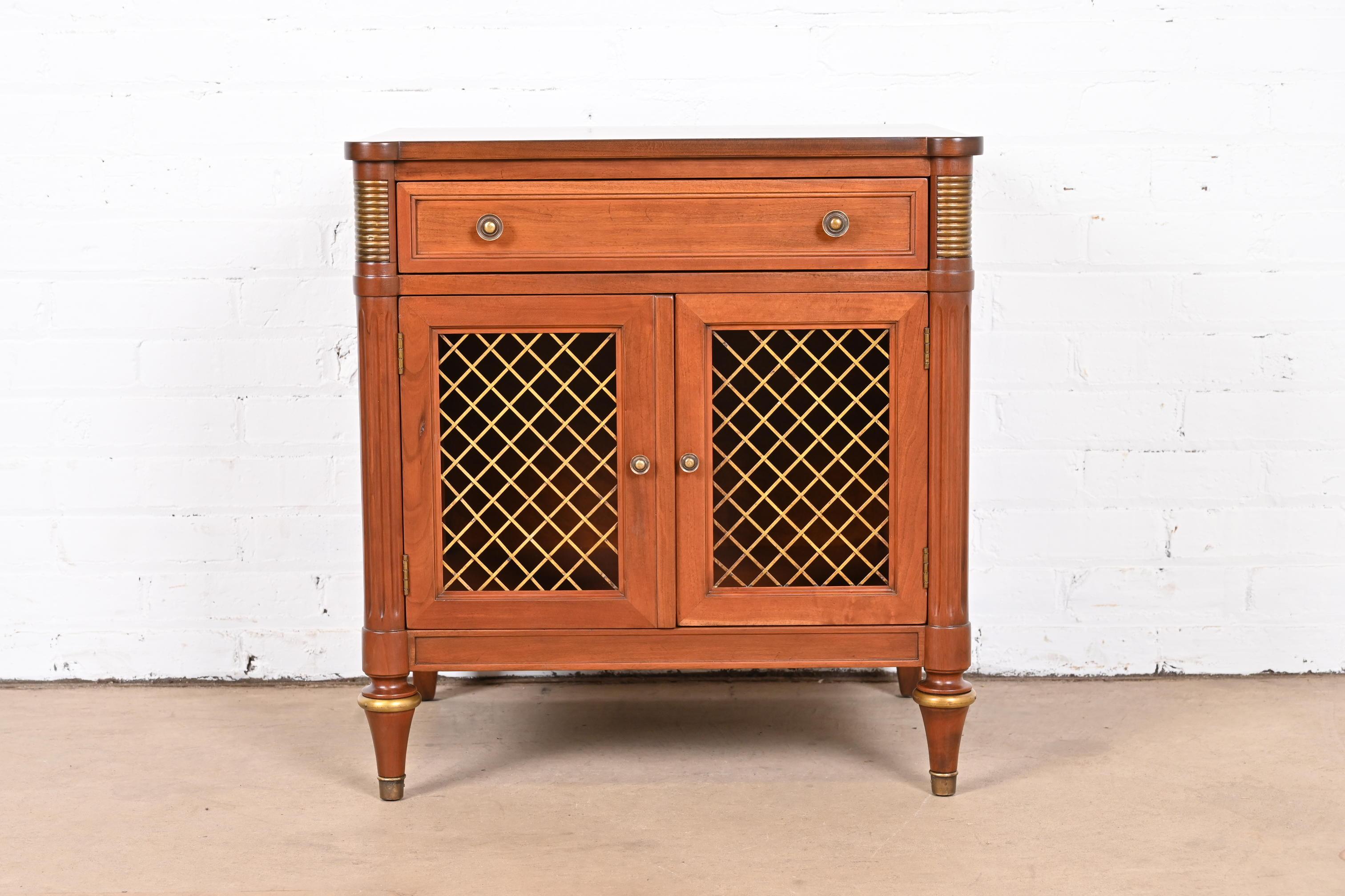 A gorgeous French Regency Louis XVI style bedside table

By Kindel Furniture

USA, Circa 1980s

Carved cherry wood, with gold gilt details and brass hardware.

Measures: 23.75