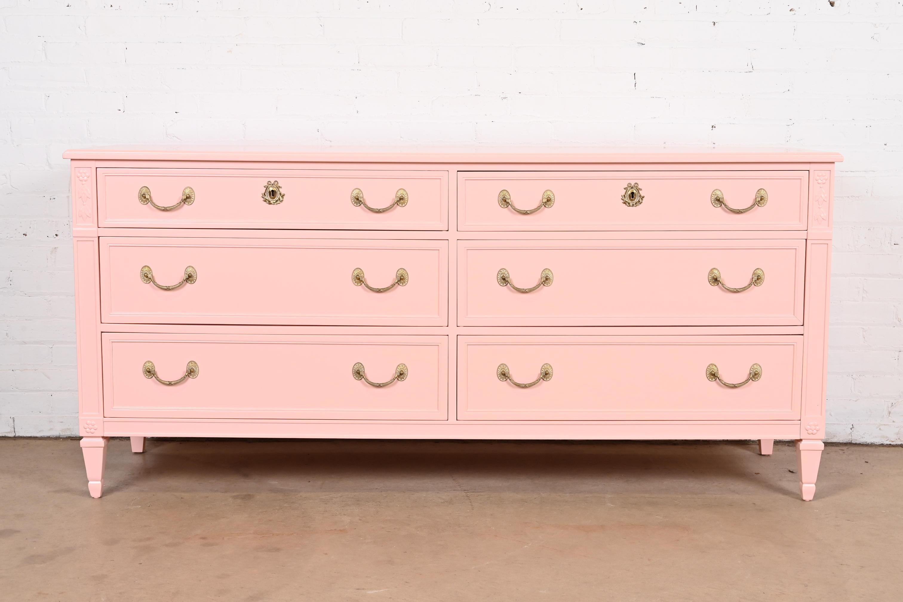 A gorgeous French Regency Louis XVI style six-drawer dresser or chest of drawers

By Kindel Furniture

USA, Circa 1960s

Pink lacquered solid cherry wood, with original brass hardware.

Measures: 70
