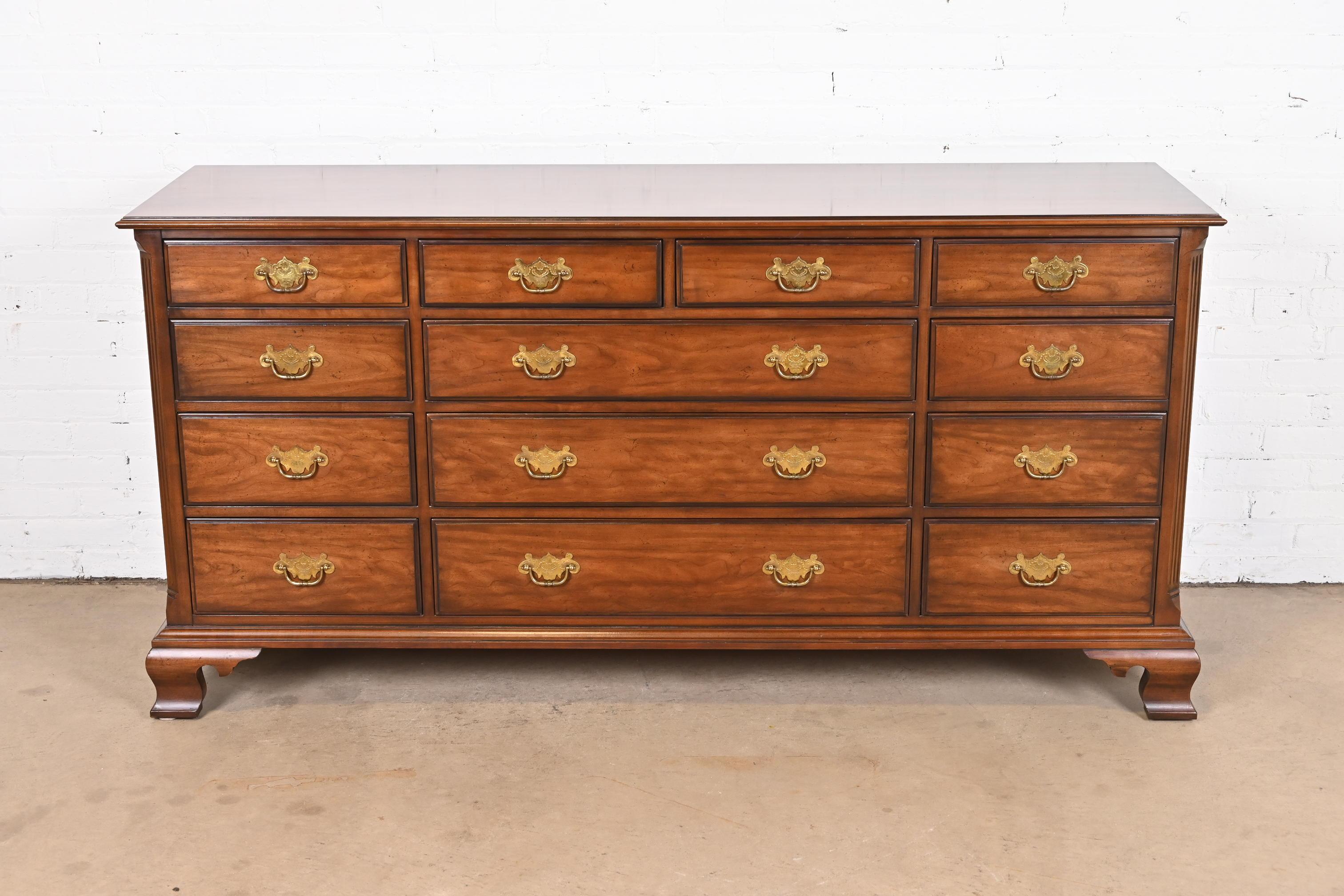 An exceptional Georgian or Chippendale style thirteen-drawer dresser chest

By Kindel Furniture

USA, Late 20th Century

Solid cherry wood, with original brass hardware.

Measures: 70.75