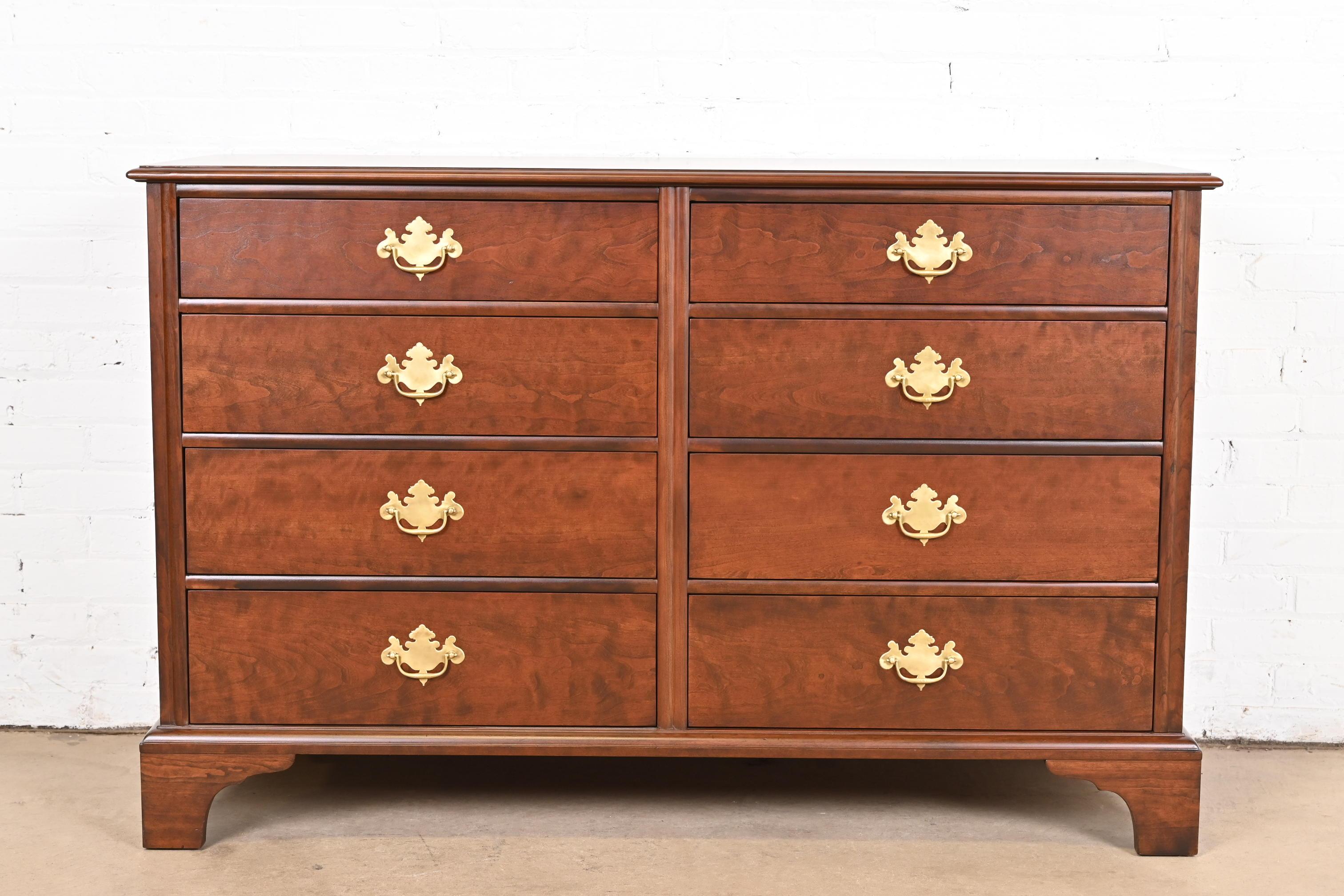 A gorgeous Georgian or Chippendale style eight-drawer dresser or chest of drawers

By Kindel Furniture

USA, Circa 1980s

Beautiful carved cherry wood, with original brass hardware.

Measures: 53.88