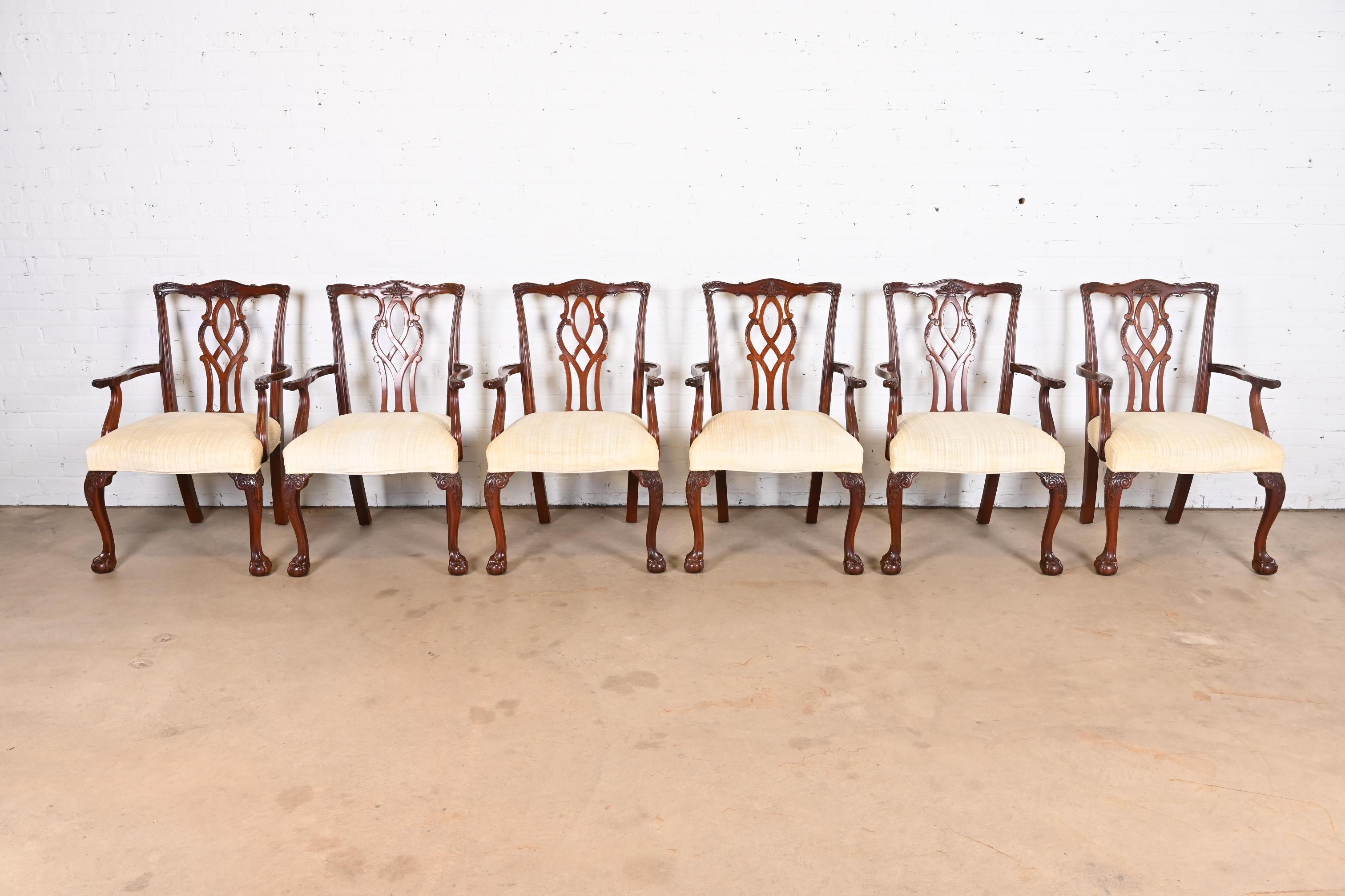 A gorgeous set of six Georgian or Chippendale style dining armchairs

By Kindel Furniture

USA, 1995

Solid carved mahogany frames, with ball and claw feet and ivory upholstered seats.

Measures: 25