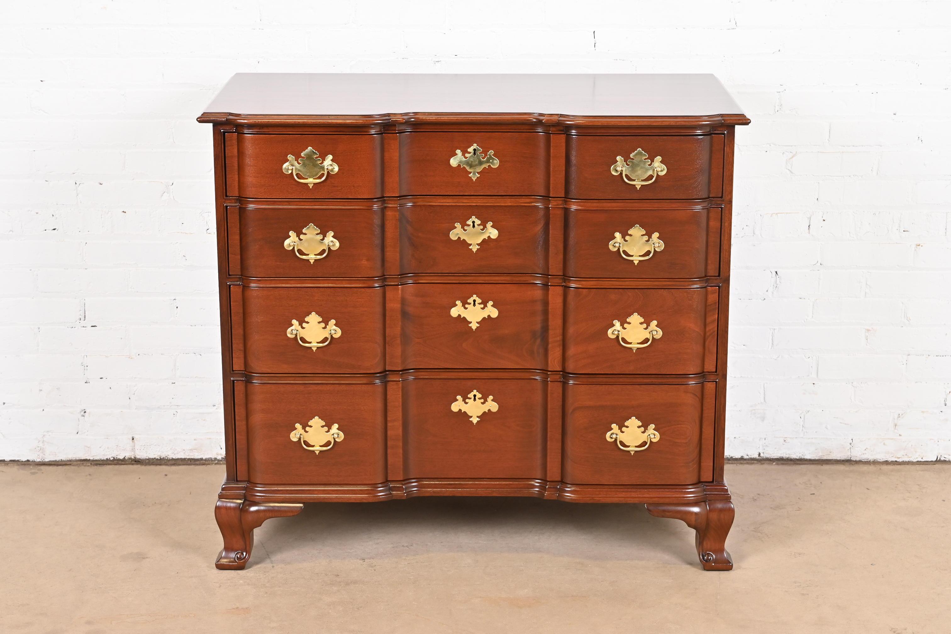 A gorgeous Georgian or Chippendale style four-drawer dresser, chest of drawers, or commode

By Kindel Furniture

USA, Circa 1980s

Beautiful carved mahogany, with original brass hardware.

Measures: 42