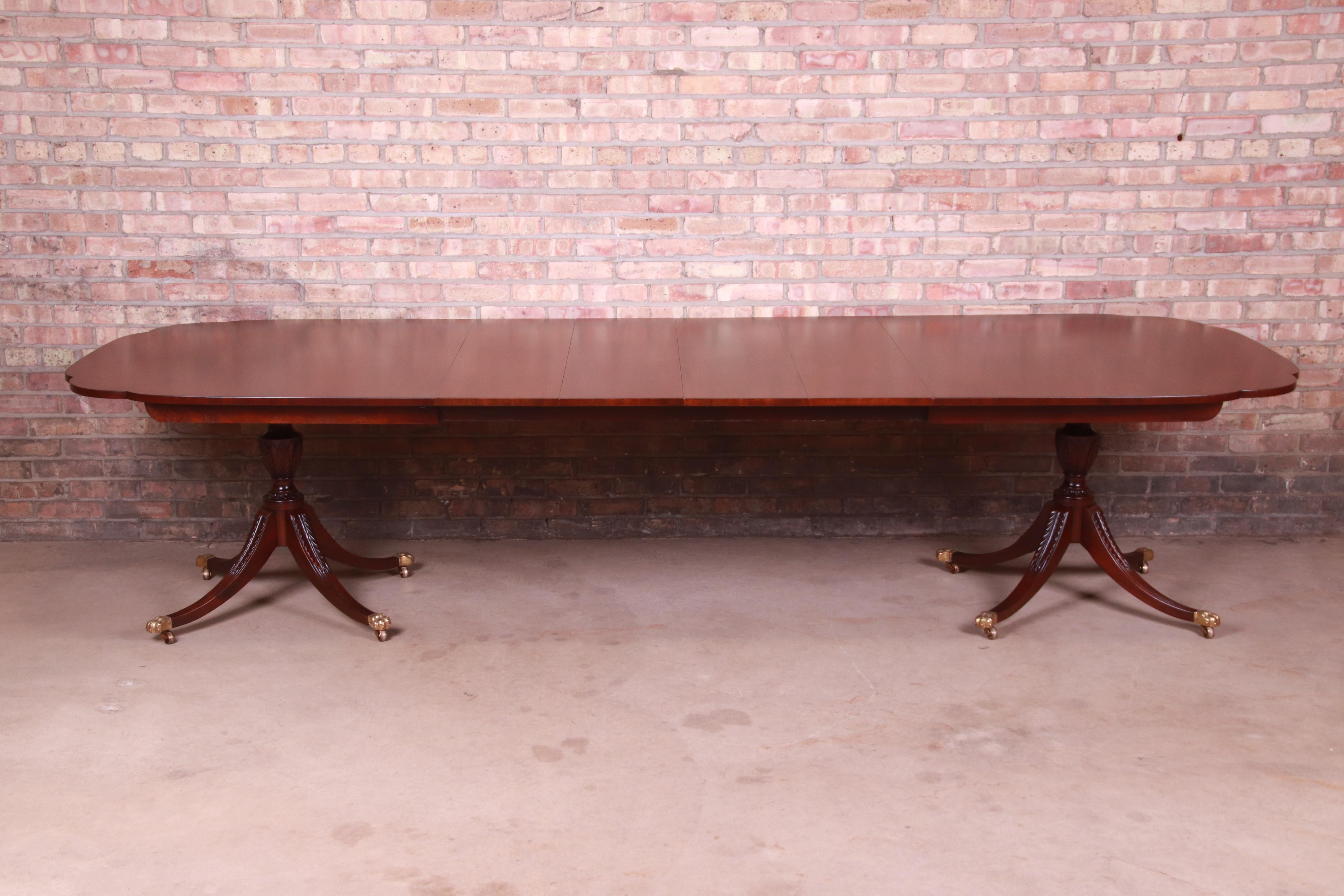 A gorgeous Georgian style double pedestal extension dining table

By Kindel Furniture

USA, Circa 1980s

Mahogany, with scalloped corners, carved solid mahogany legs, and brass-capped paw feet.

Measures: 78
