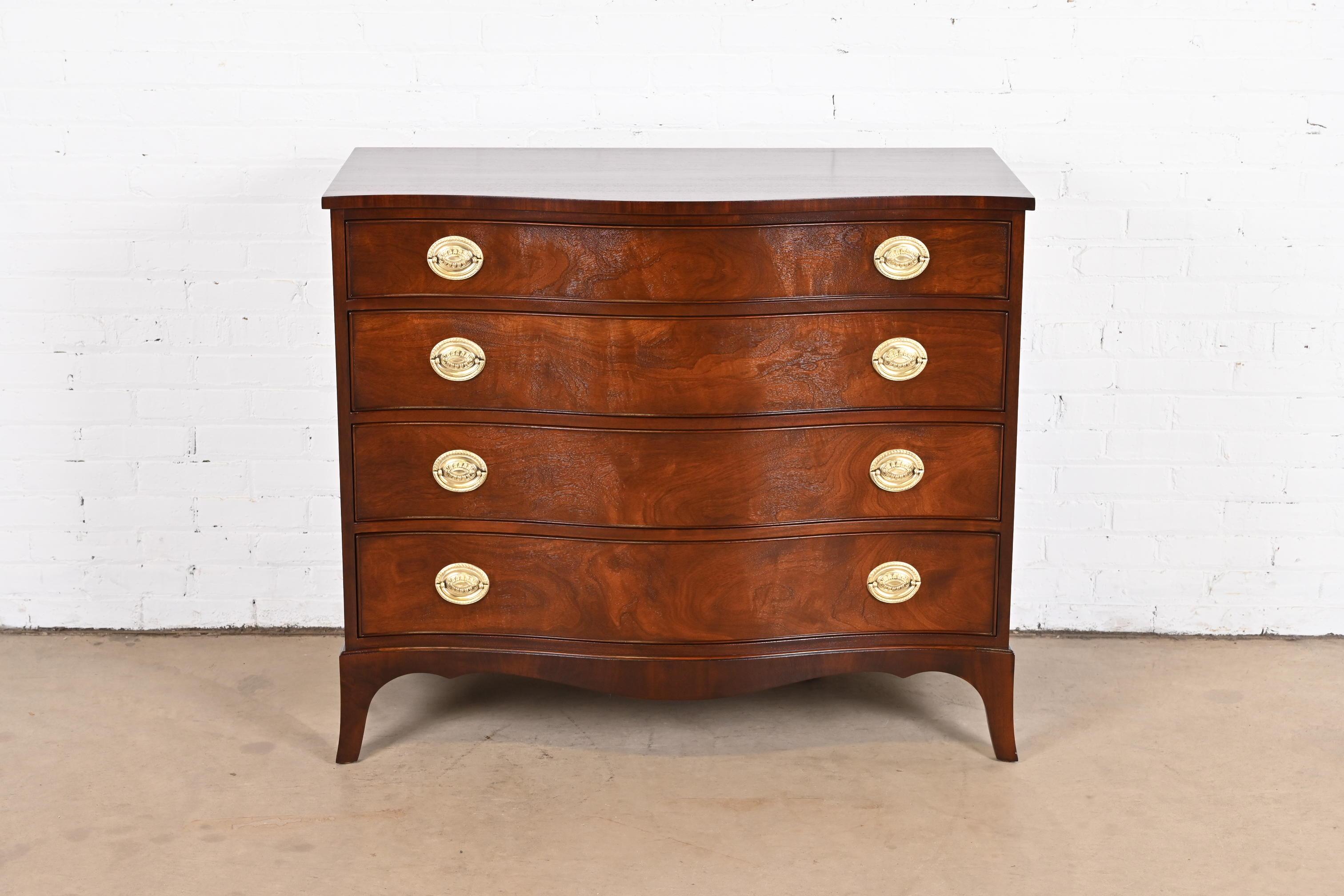 An exceptional Georgian or Chippendale style dresser chest or commode

By Kindel Furniture

USA, Mid-20th Century

Gorgeous figured mahogany, with original brass hardware.

Measures: 44