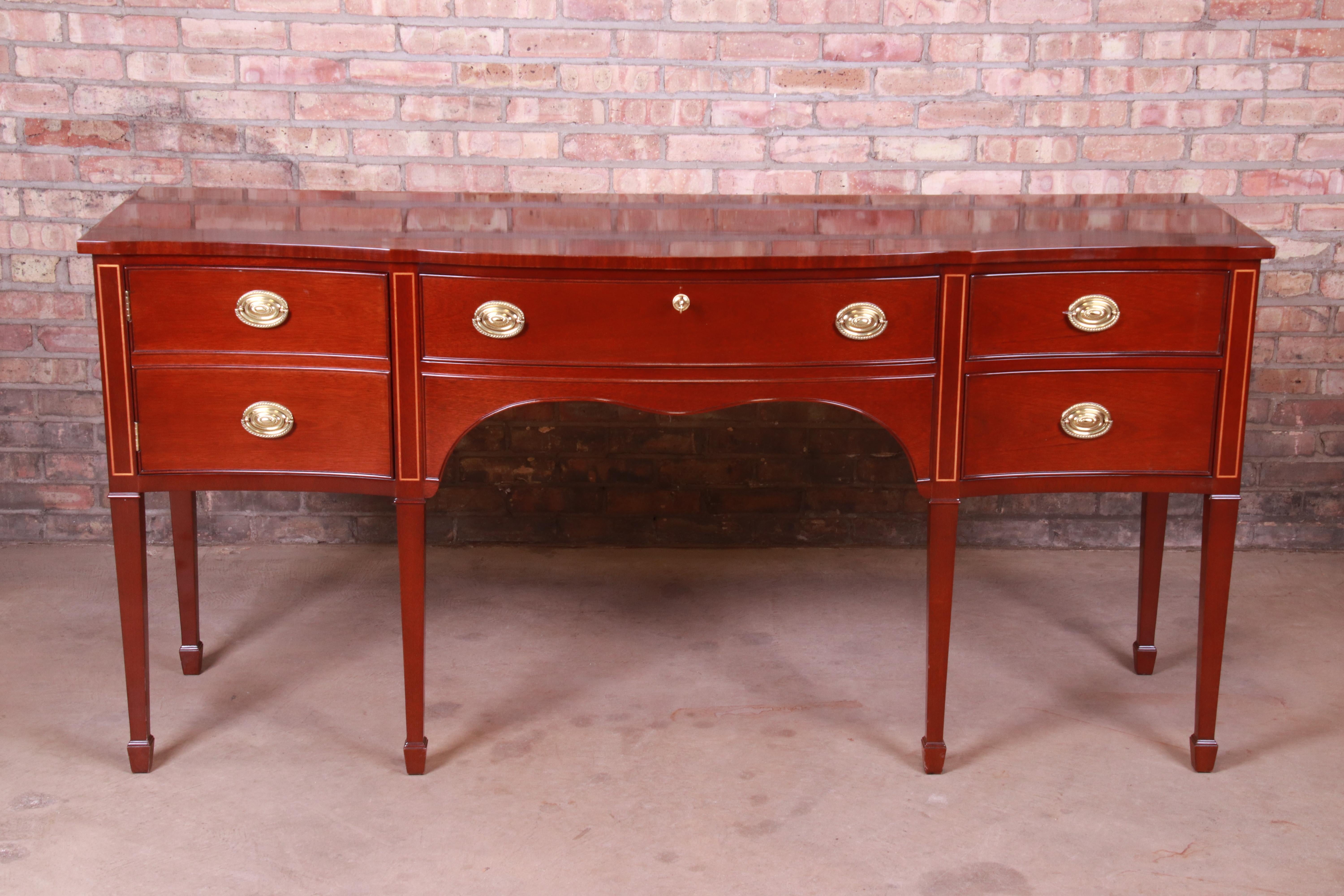 A gorgeous Hepplewhite style sideboard buffet or credenza

By Kindel Furniture

USA, circa 1980s

Mahogany, with original brass hardware.

Measures: 72