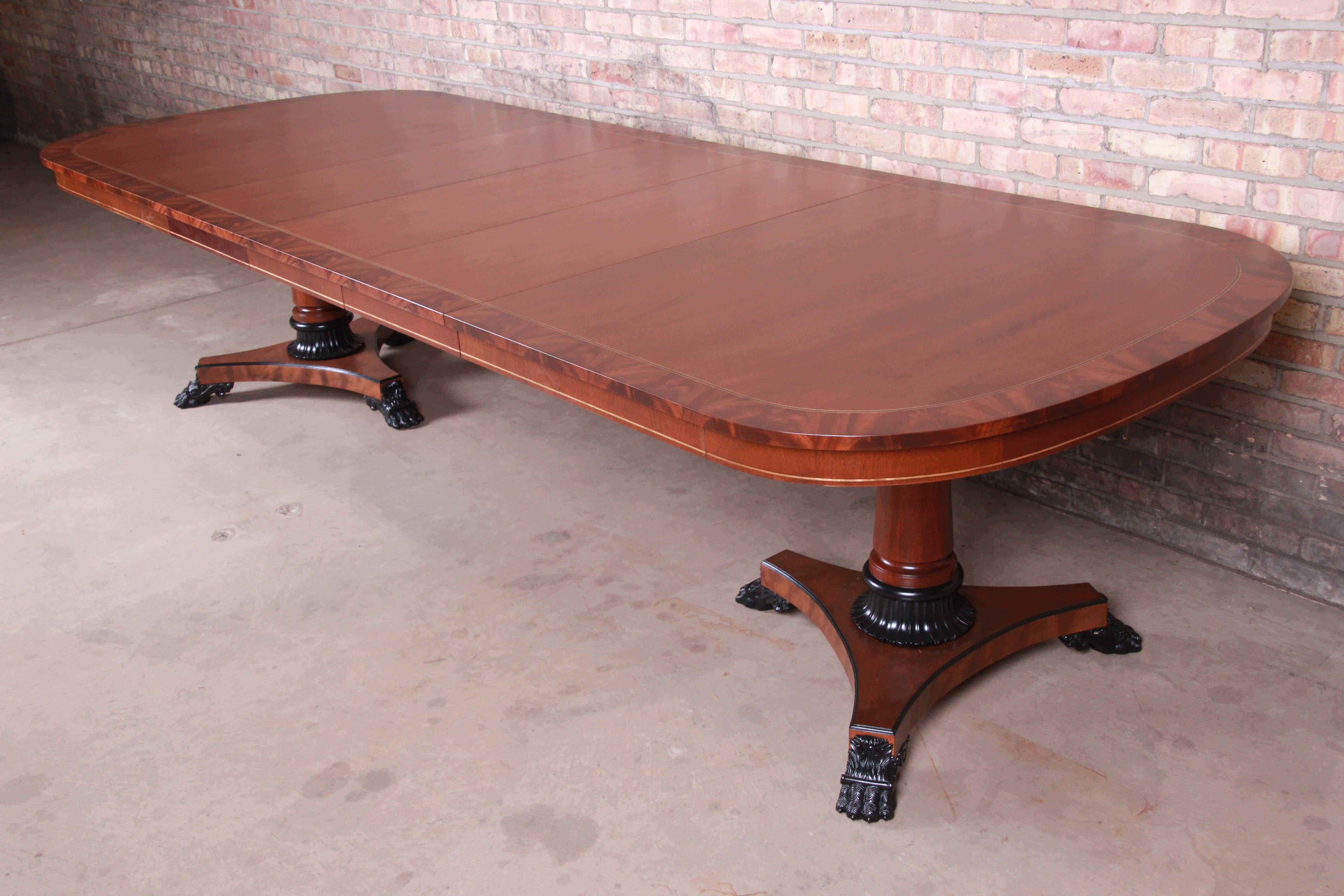 An exceptional neoclassical double pedestal extension dining table

By Kindel Furniture

USA, 1990s

Book-matched mahogany, with flame mahogany banding and ebonized paw feet and accents.

Measures: 80