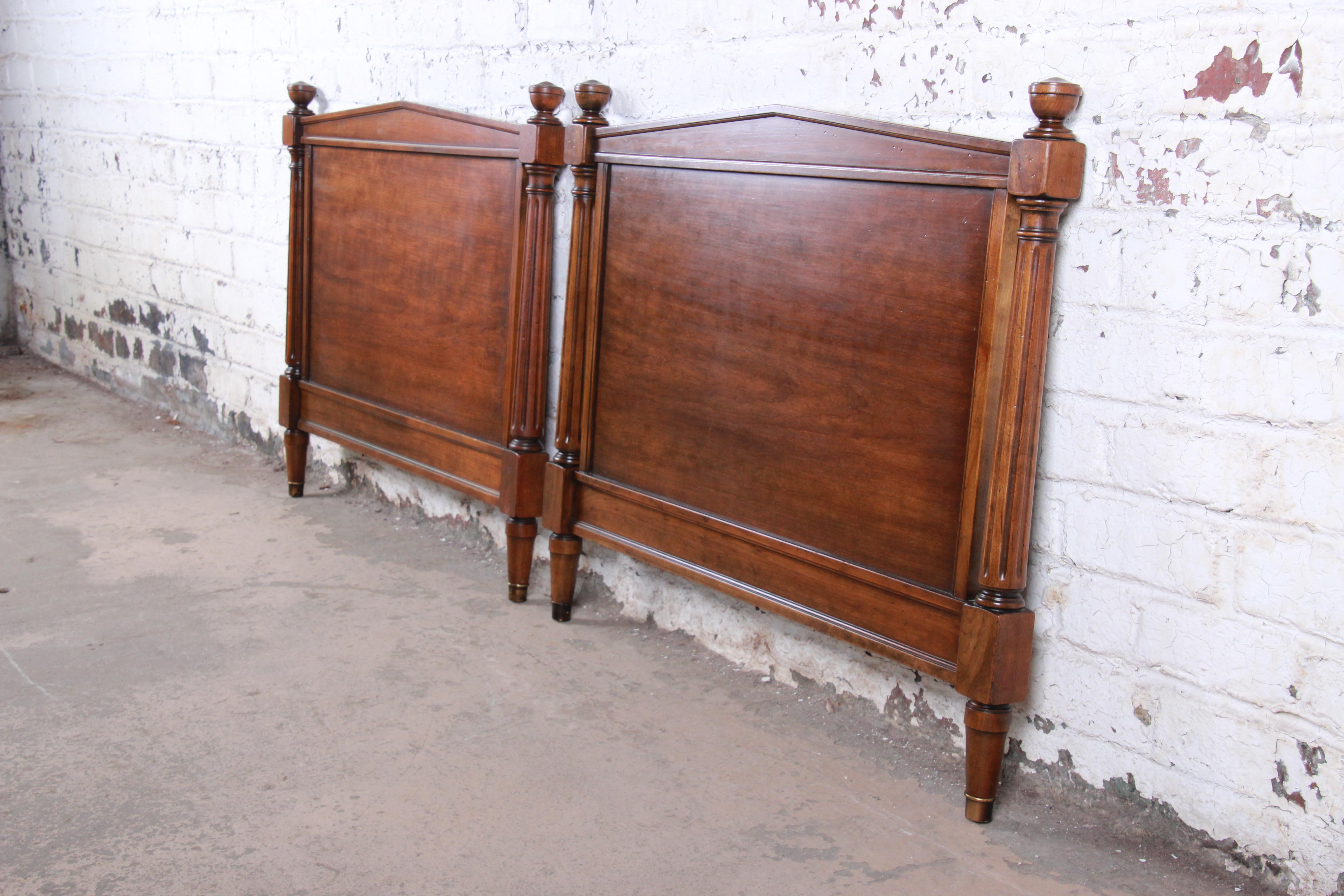 A gorgeous pair of midcentury neoclassical style walnut twin size headboards

By Kindel Furniture

USA, circa 1960s

Carved walnut, with brass-capped feet.

Measures: 39.38