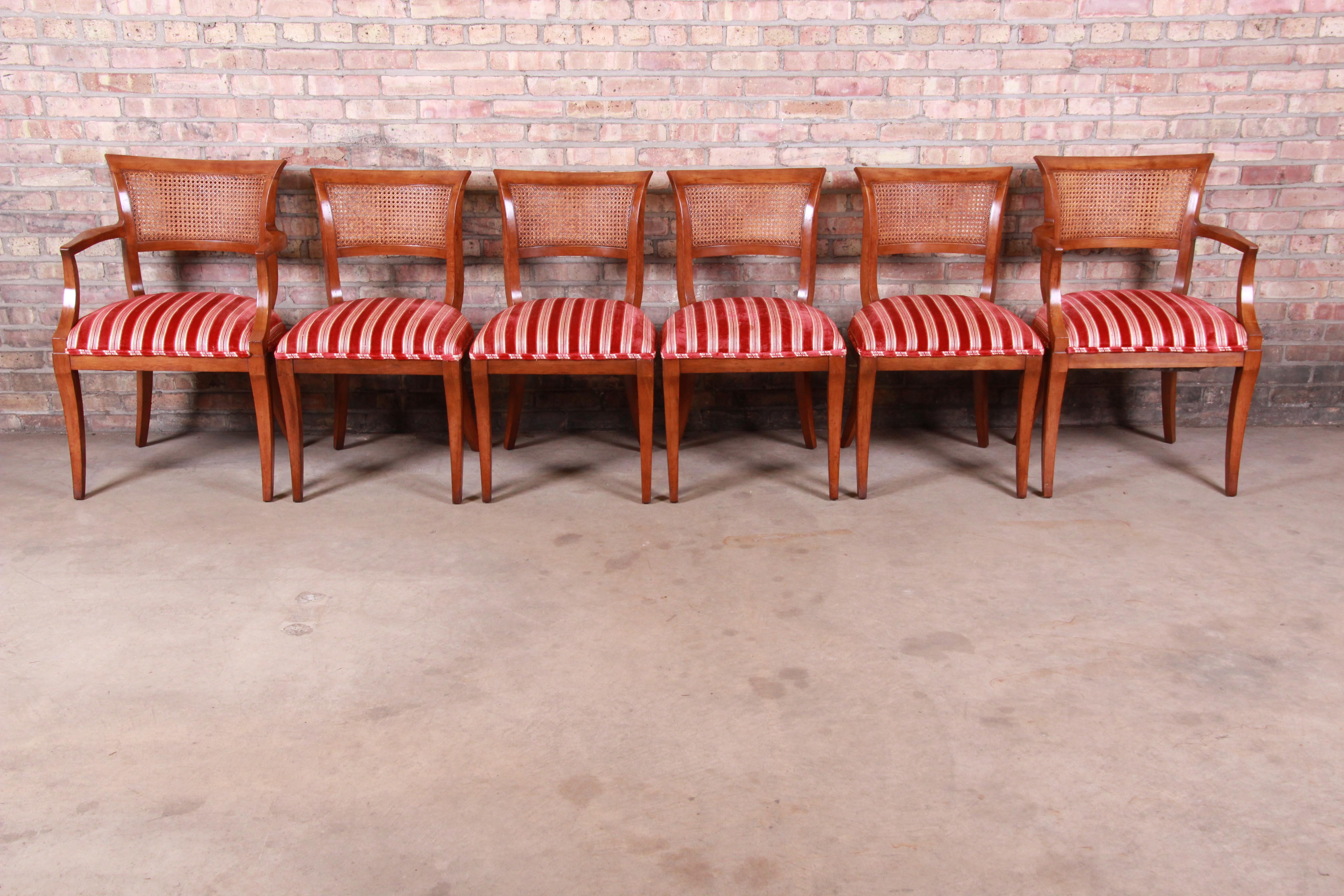 A gorgeous set of six Regency style cane back dining chairs

By Kindel Furniture

USA, circa 1970s

Solid cherrywood, with cane backs and upholstered seats.

Measures:
Armchairs 22.25