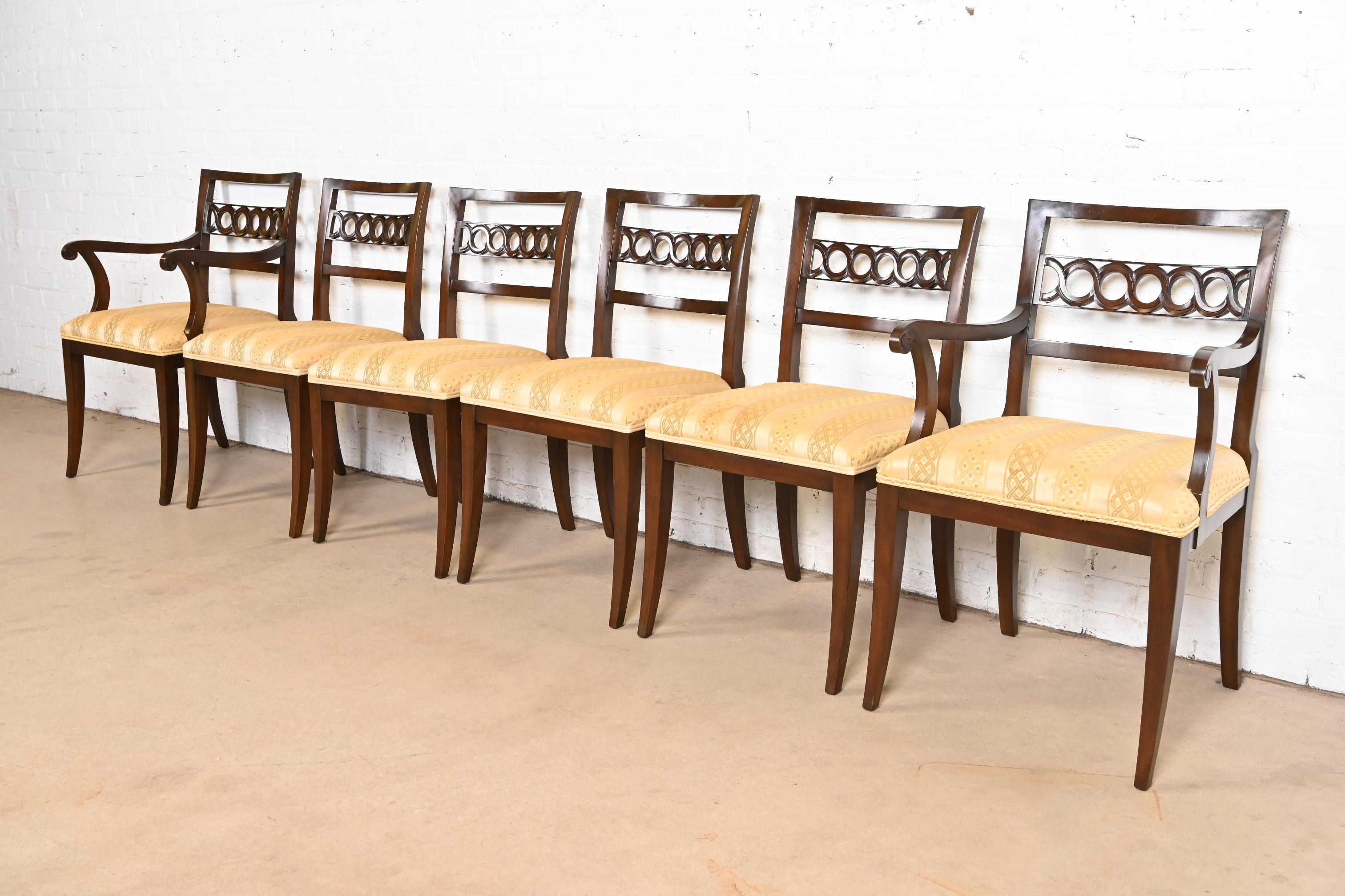 A beautiful set of six Regency or Neoclassical style dining chairs

By Kindel Furniture

USA, Circa 1960s

Solid cherry wood frames, with upholstered seats.

Measures:
Side chairs - 19.25