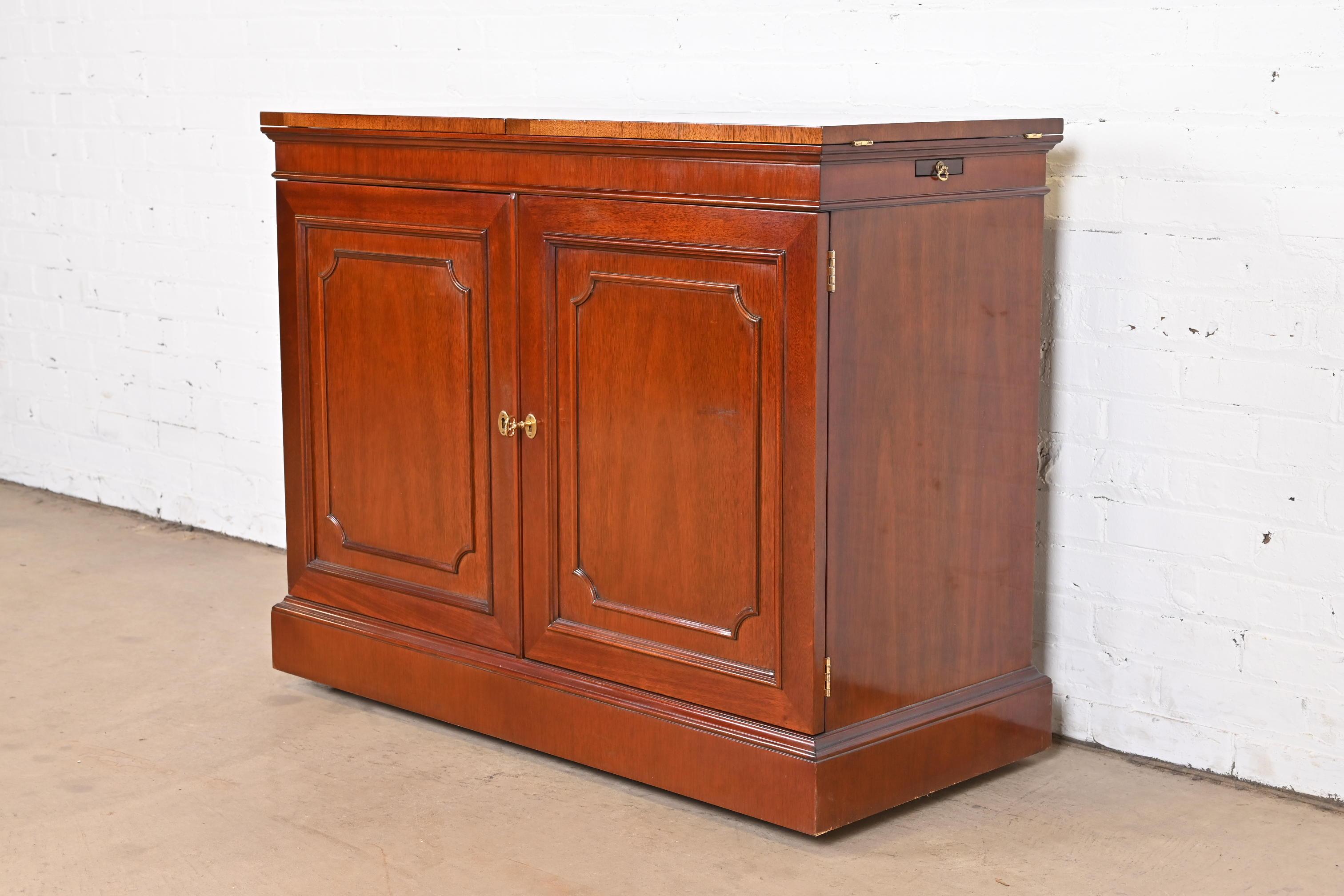 American Kindel Furniture Regency Mahogany Flip Top Rolling Bar Cabinet For Sale