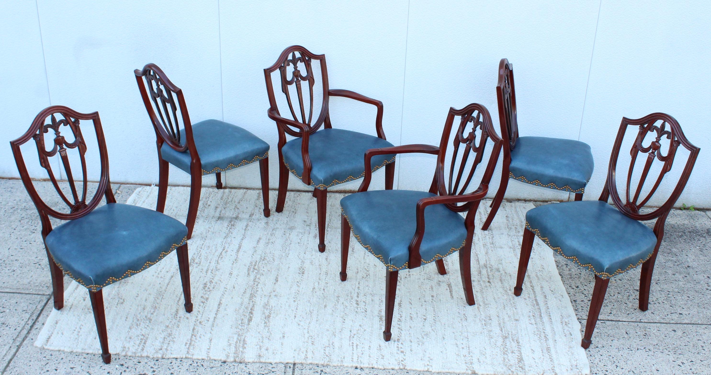 1970's mahogany and leather with brass nail detail dining chairs by Kindel furniture, in vintage original condition with some wear and patina due to age and use, there is some wear and a few stains to the leather and some wear to the wood.

Side
