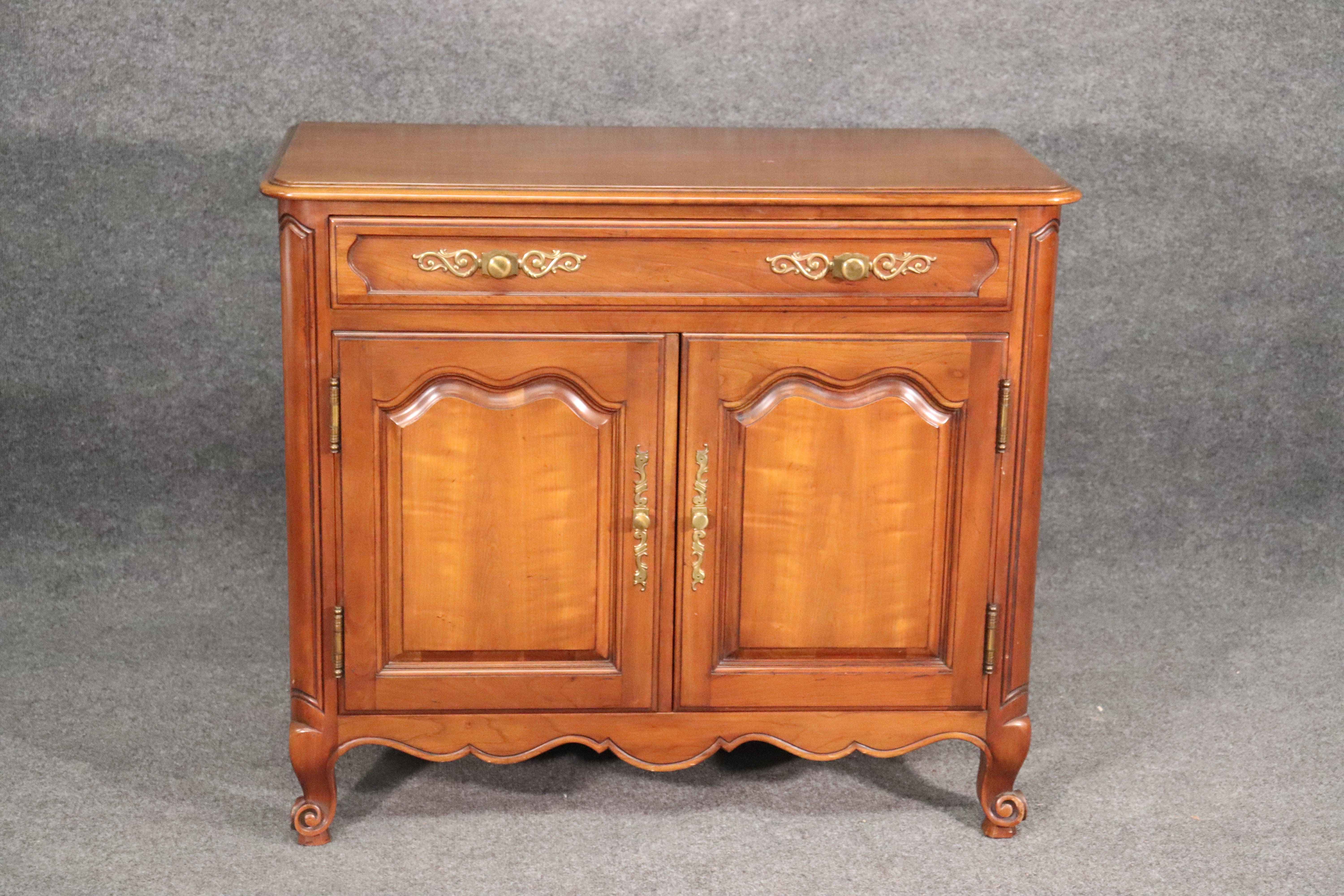 This is a beautiful and extremely high quality buffet from Kindel. This piece features solid cherry and dovetailed construction. The buffet is clean and in good condition and measures 49.75 wide x 19 deep x 34 tall.