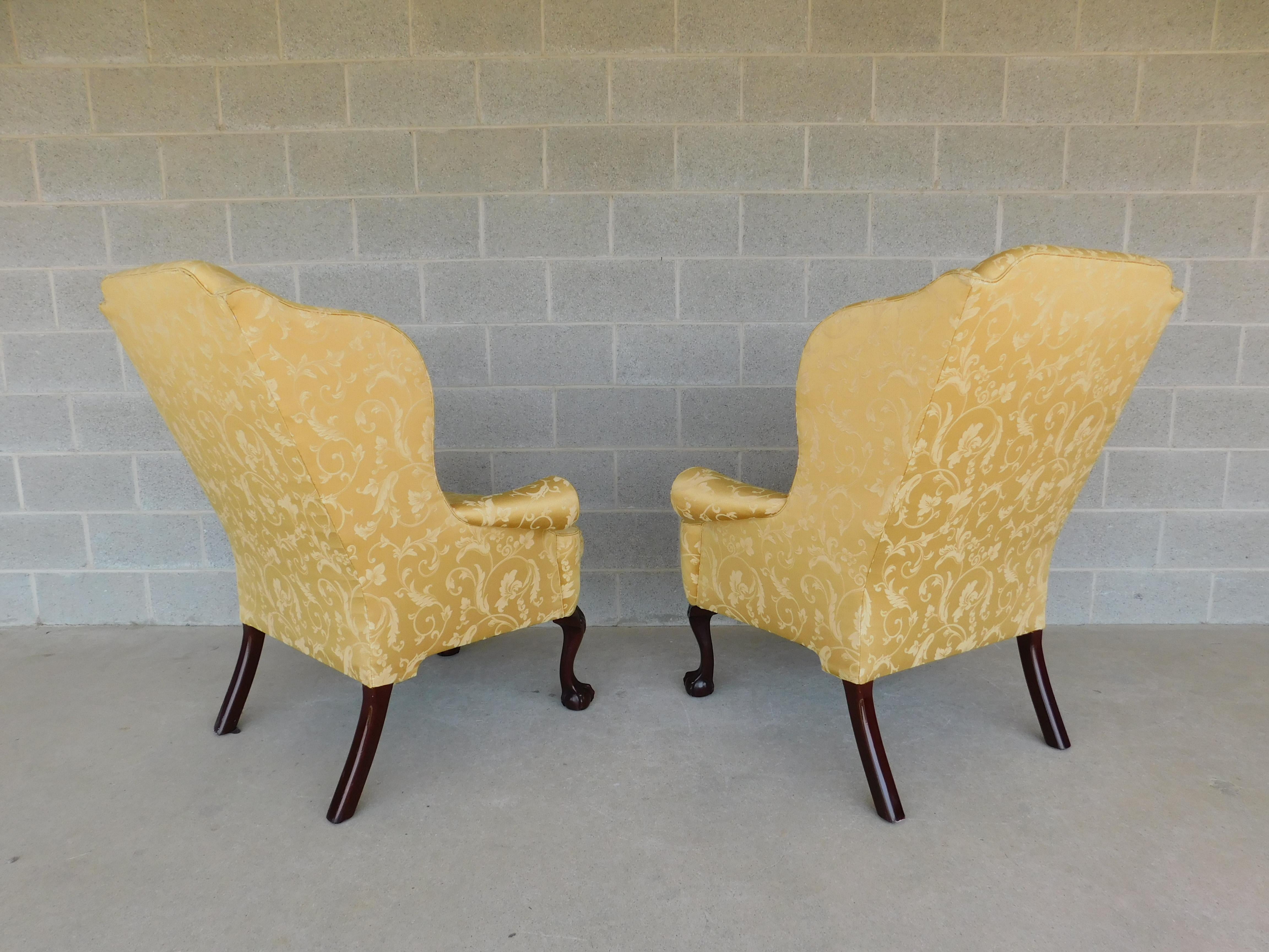 KIndel Winterthur Chippendale Ball & Claw Wingback Chairs - a Pair

Original upholstery, down filled seat cushion, hand rubbed finish Mahogany shell carved knees ball & claw feet

Golden yellow silk fabric, small wear area on the backside of the top