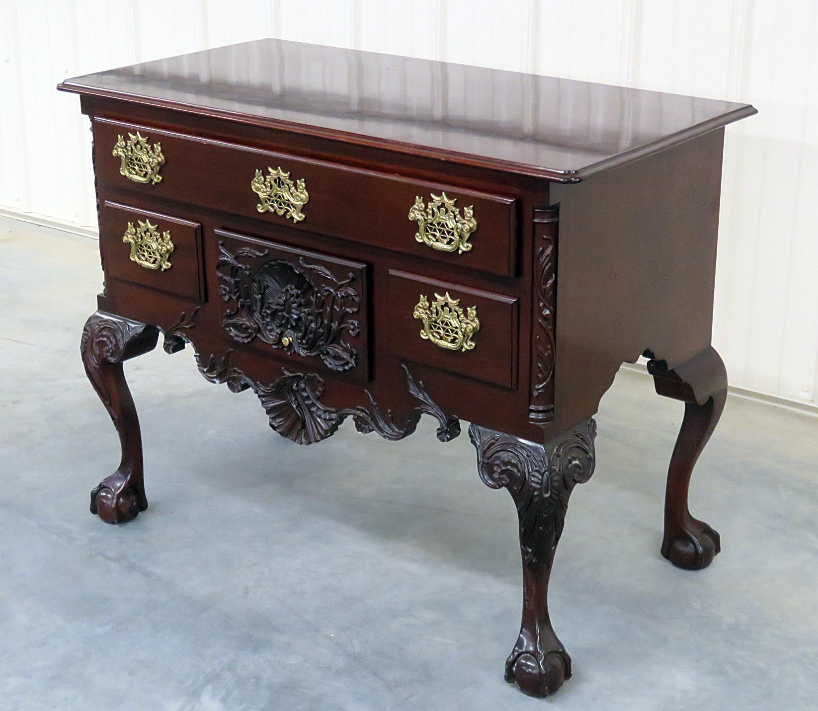 Kindel Winterthur mahogany Georgian style 4-drawer lowboy on ball and claw feet.