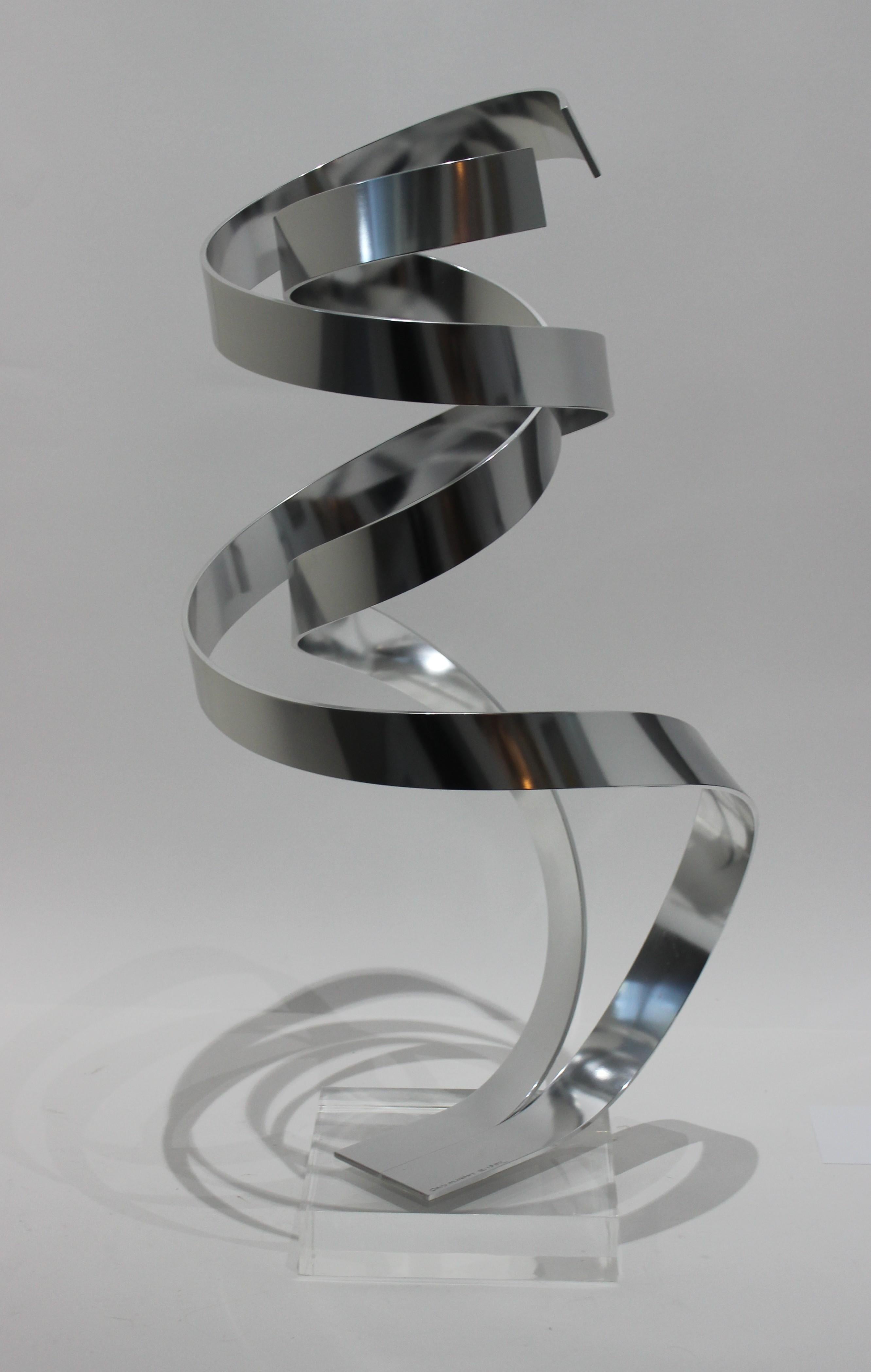 Kinetic abstract sculpture in anodized aluminum by Dan Murphy, 1982.

Note: Exhibits a wonderful springy movement when moved or touched.