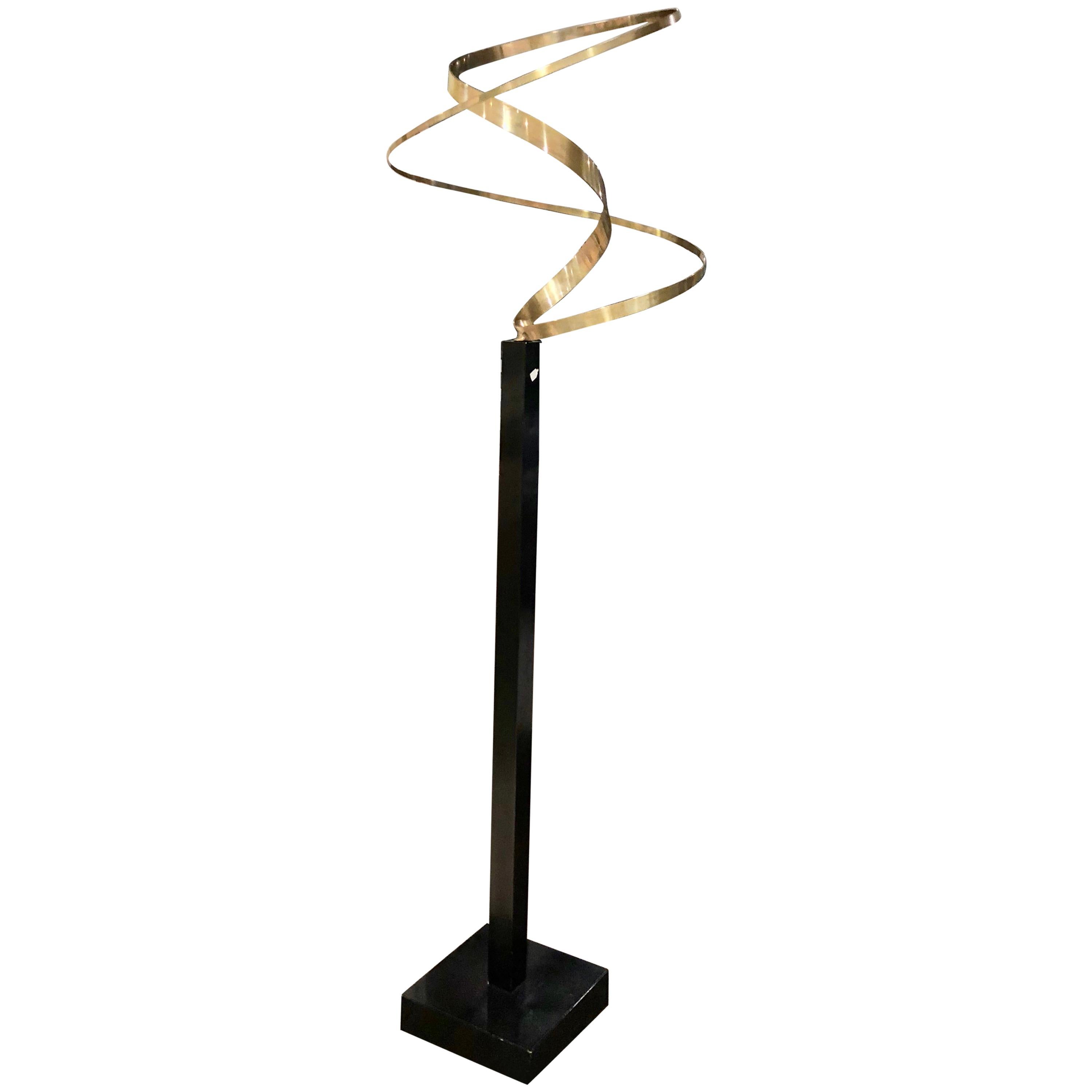 Kinetic Brass Ribbon Sculpture Set on a Tall Metal Stand in the style of Jere.