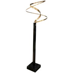 Kinetic Brass Ribbon Sculpture Set on a Tall Metal Stand in the style of Jere.