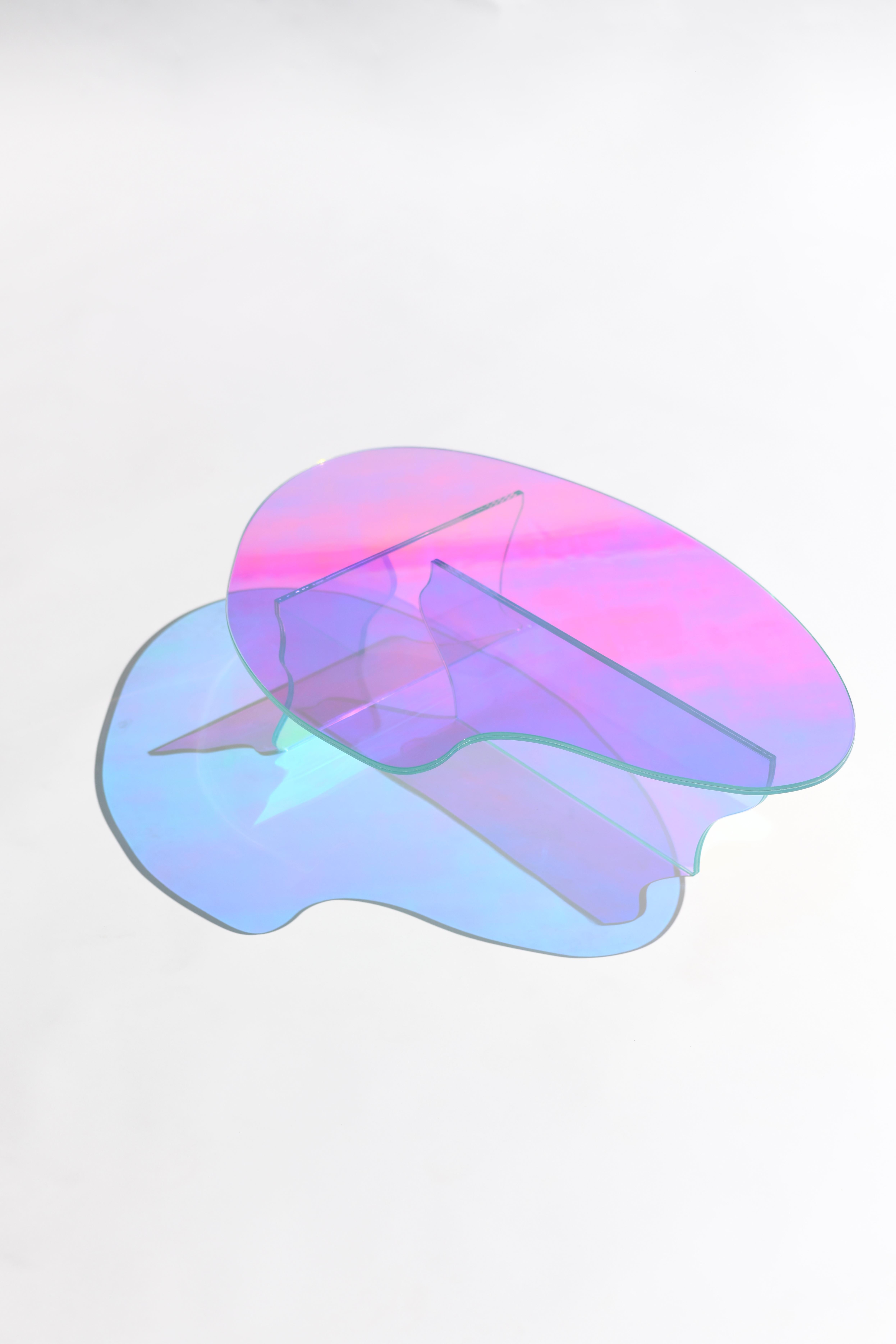 Kinetic colors glass table by Brajak Vitberg
Materials: Glass, dichroic film
Dimensions: 77 x 43 x 40 cm

Bijelic and Brajak are two architects from Ljubljana, Slovenia.
They are striving to design craft elements and make them timeless through