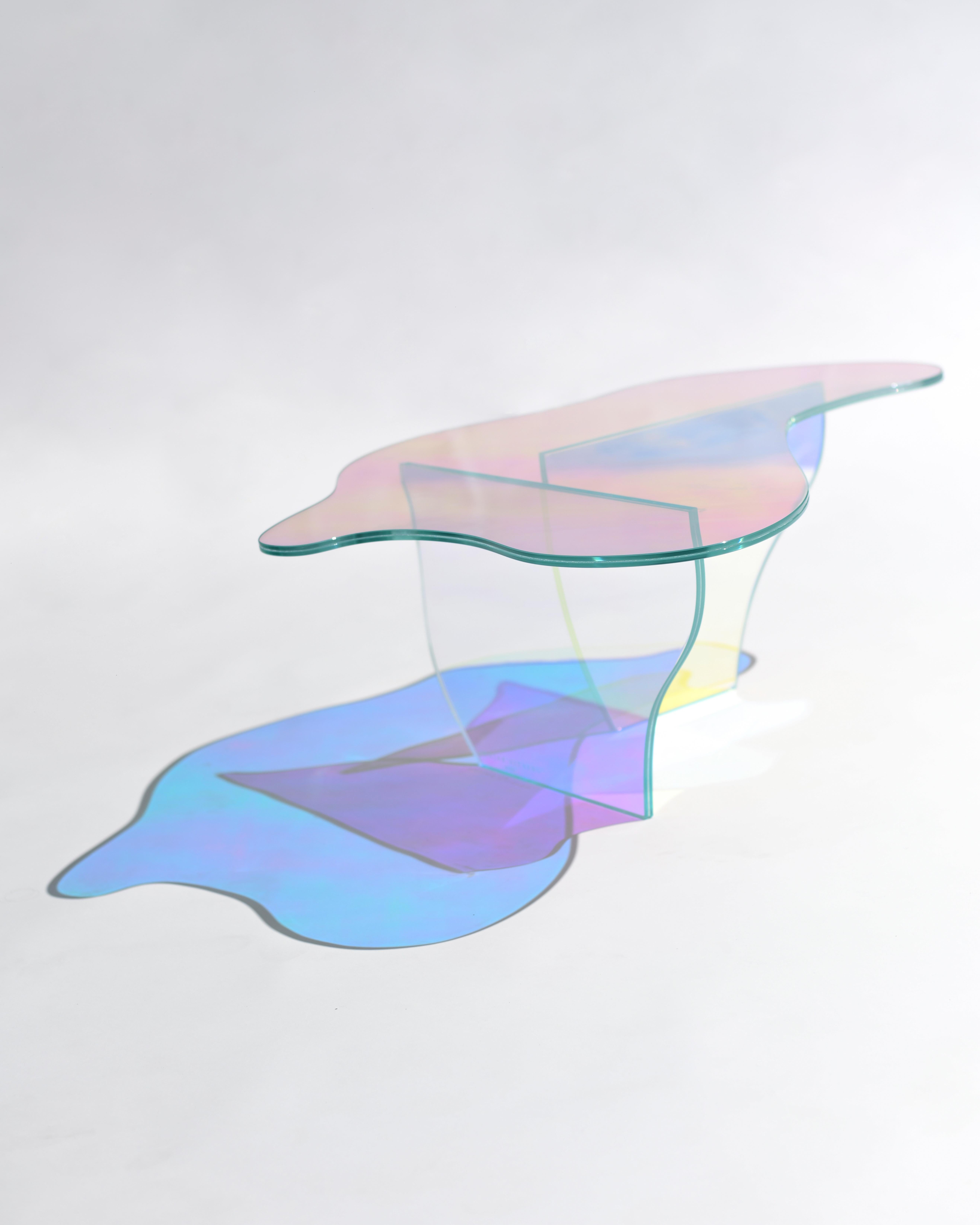 Kinetic colors glass table by Brajak Vitberg
Materials: Glass, dichroic film
Dimensions: 87 x 57 x 30 cm

Bijelic and Brajak are two architects from Ljubljana, Slovenia.
They are striving to design craft elements and make them timeless through