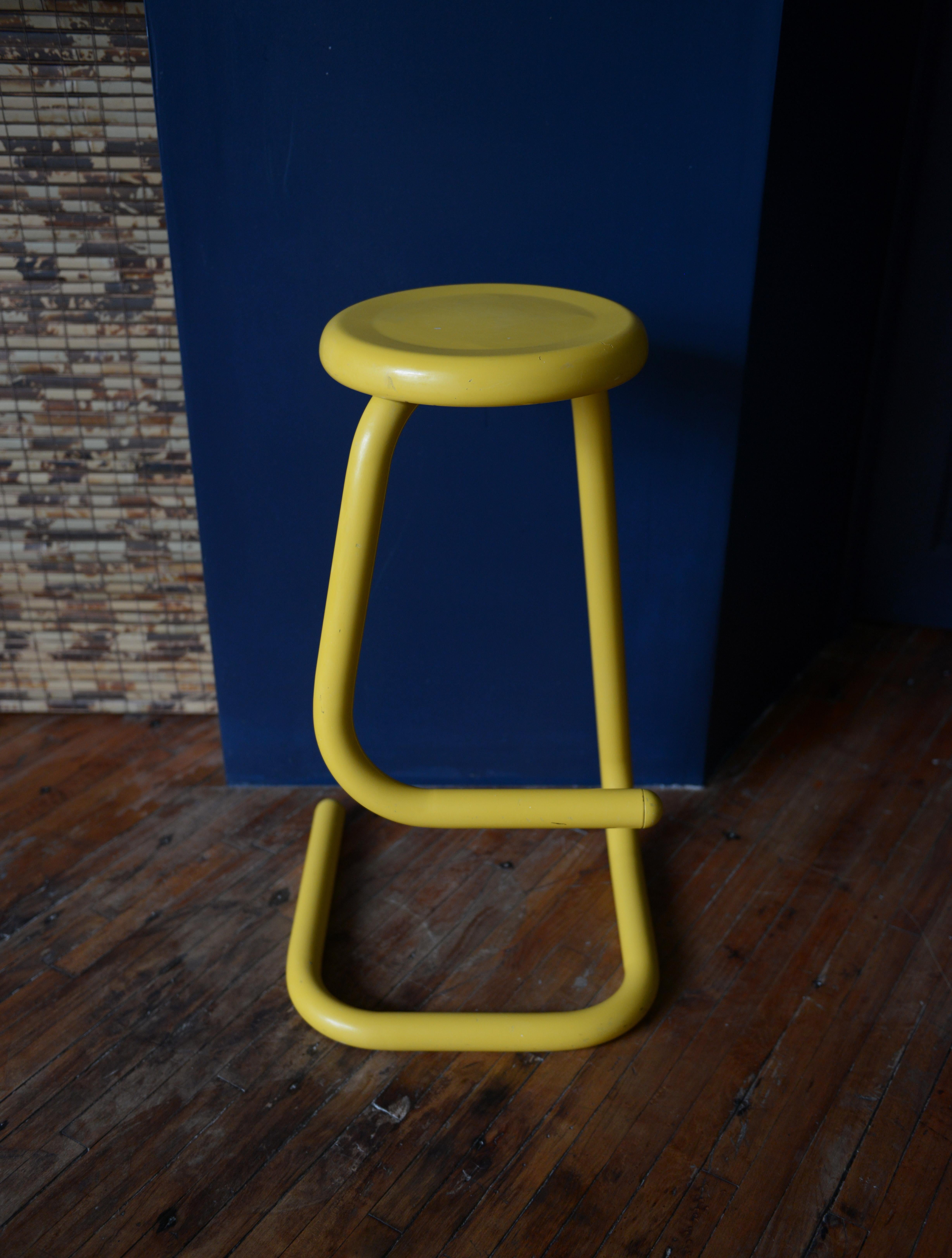 Paperclipmania! This is one awesome Haworth K700 Paperclip Barstool by Kinetics for Amisco. The bright yellow stool is the perfect room accent piece/ plant stand while still being a functional stool. The stool’s tubular steel frame offers a clean