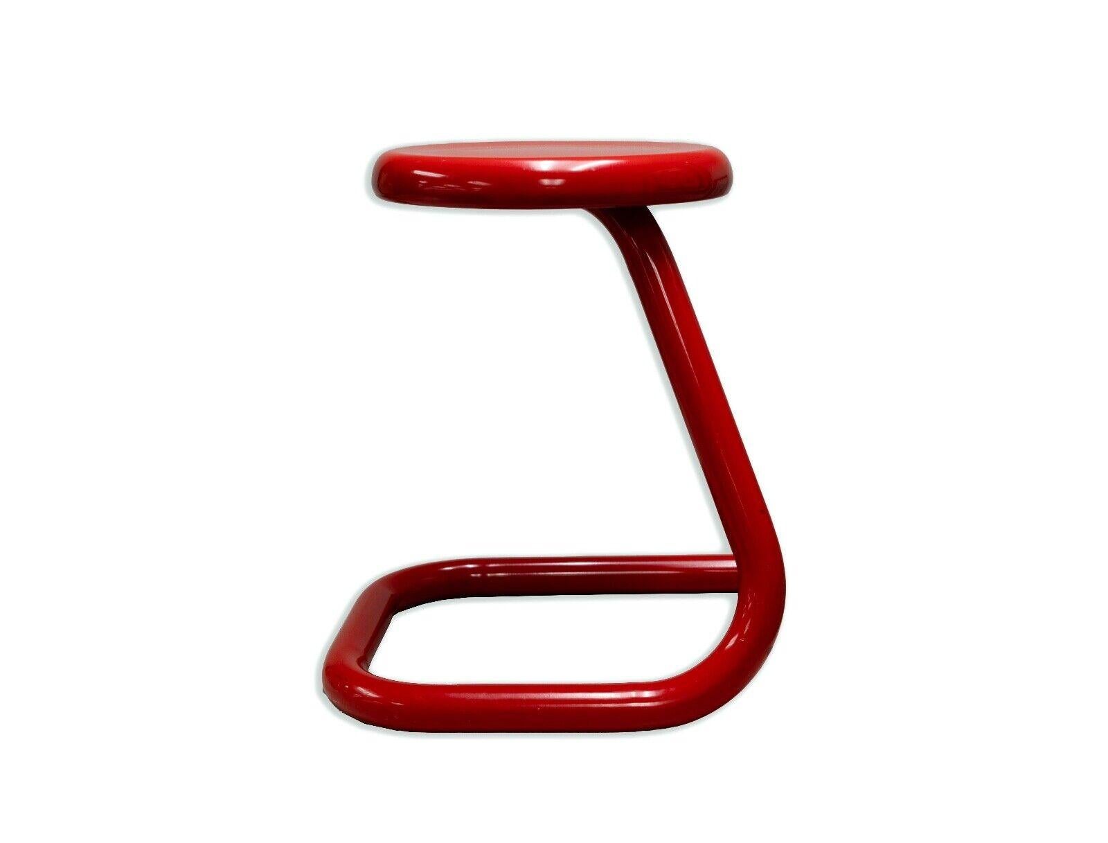 The Kinetics Red Paperclip Stool is a bold statement piece that embodies the essence of contemporary modern design. Made in Canada, this stool boasts a vibrant red finish on a sleek, continuous metal frame that takes inspiration from the playful