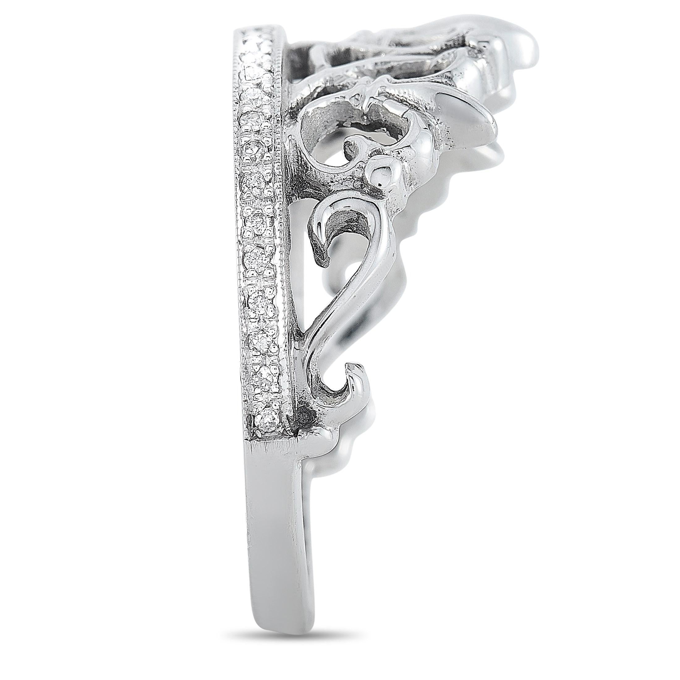 This King Baby Tiara ring is crafted from 14K white gold and embellished with gemstones. The ring weighs 7.3 grams and boasts a band thickness of 2 mm and a top height of 3 mm, while top dimensions measure 24 by 11 mm.

Offered in brand-new