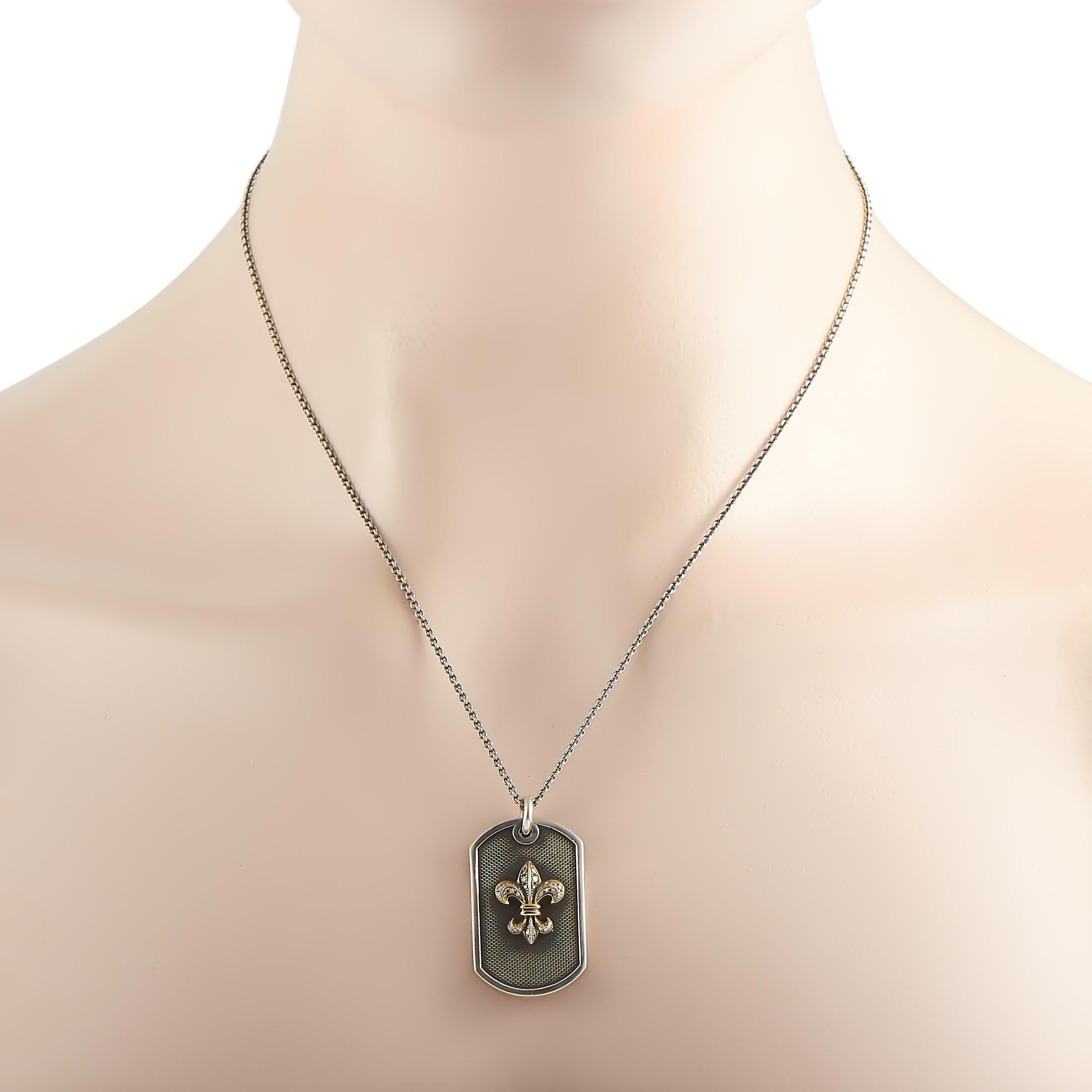 This limited edition King Baby necklace is made out of sterling silver and 18K yellow gold and embellished with diamonds. The necklace is presented with a 23” chain and boasts a 1.50” by 0.75” dog tag pendant with a fleur-de-lis detail. This item
