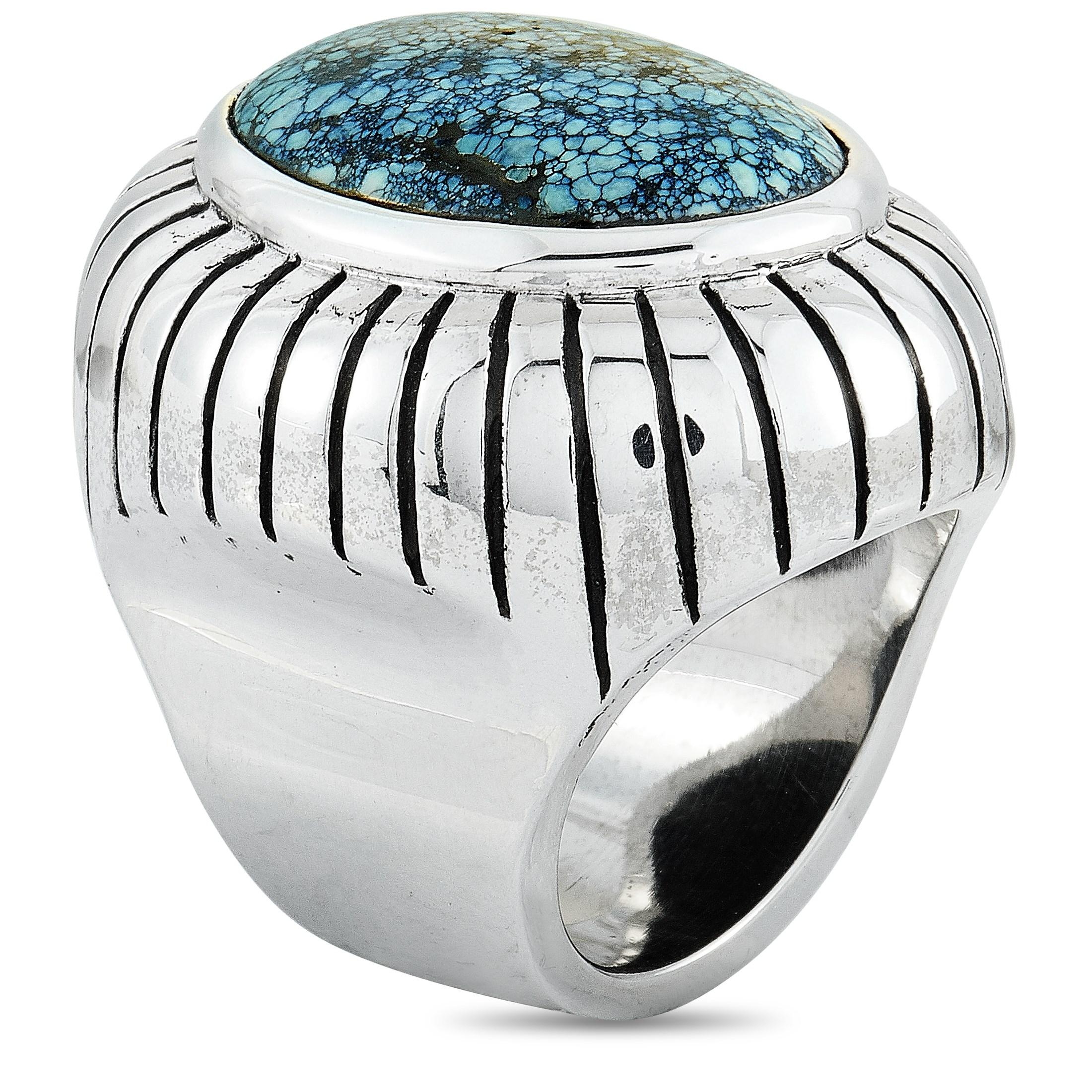 This King Baby ring is crafted from silver and set with an 18 by 25 mm spotted turquoise. The ring weighs 67.4 grams and boasts a band thickness of 10 mm and a top height of 13 mm, while top dimensions measure 27 by 34 mm.

Offered in brand-new