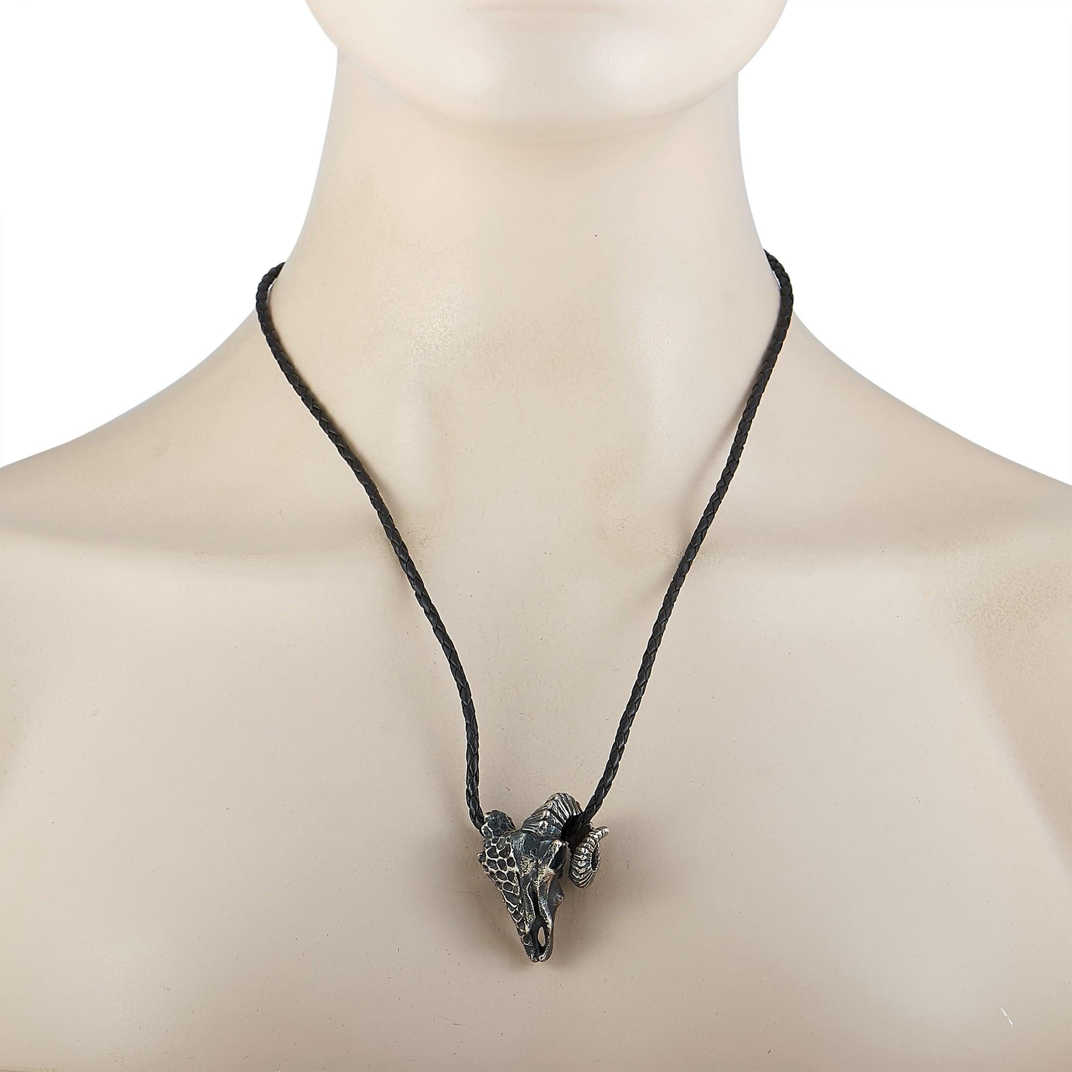 This King Baby necklace is presented with a 22” black cord onto which a silver ram skull pendant is attached, measuring 1.50” in length and 1.12” in width. The necklace weighs 33.3 grams.

Offered in brand-new condition, this jewelry piece includes