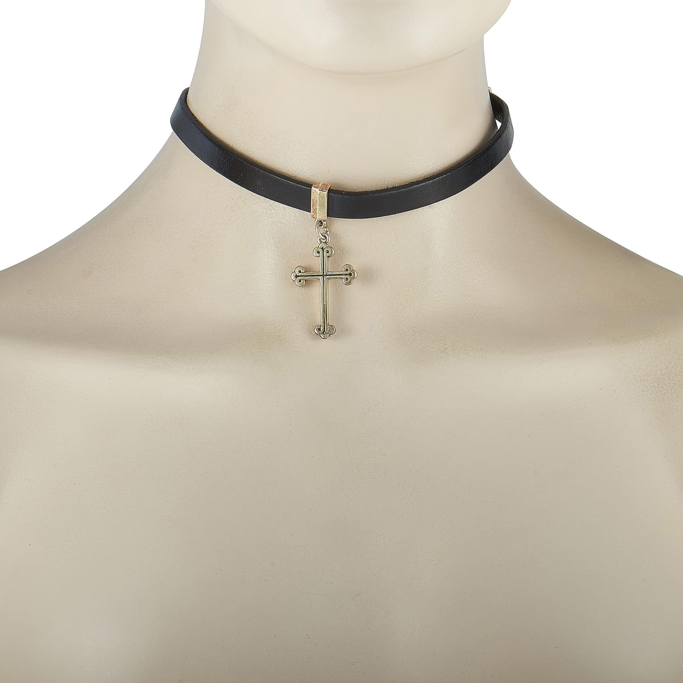 This King Baby choker necklace is made out of sterling silver and black leather and weighs 23.7 grams. The necklace measures 13” in length and boasts a cross pendant that measures 2” in length and 0.75” in width.

Offered in brand new condition,