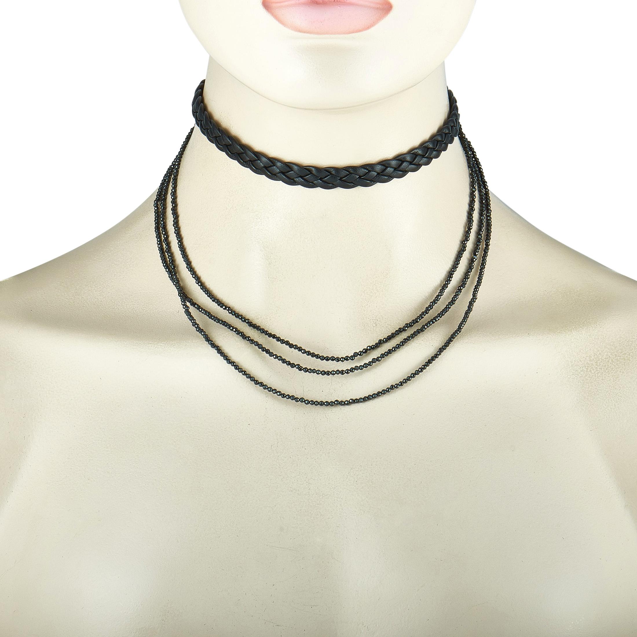 This King Baby necklace is made out of sterling silver, black leather, and spinels. The necklace weighs 23.7 grams, and the leather choker measures 11.50” in length.

Offered in brand new condition, this item includes the manufacturer’s pouch.