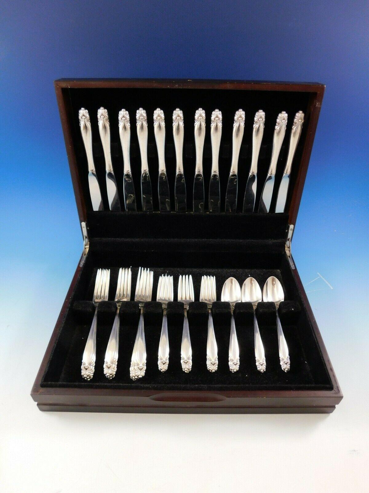 Heirloom quality King Christian by Wallace sterling silver flatware set, 48 pieces. This set includes:

12 knives, 9
