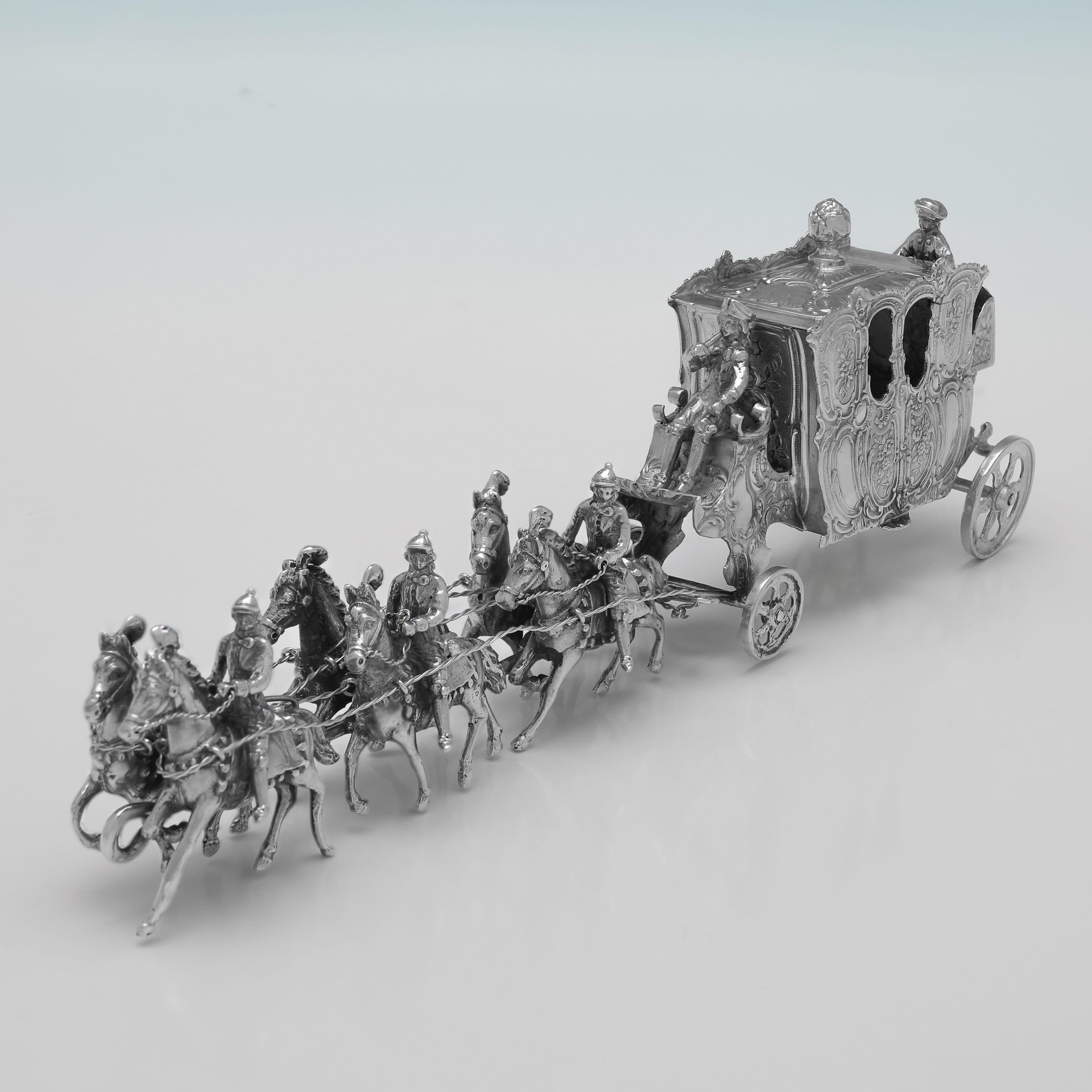 Carrying a London Import mark for 1901 by John George Piddington, this charming, Antique Sterling Silver Model of a Coach and Horses, is handsomely made. 
The coach and horses measures 3.25