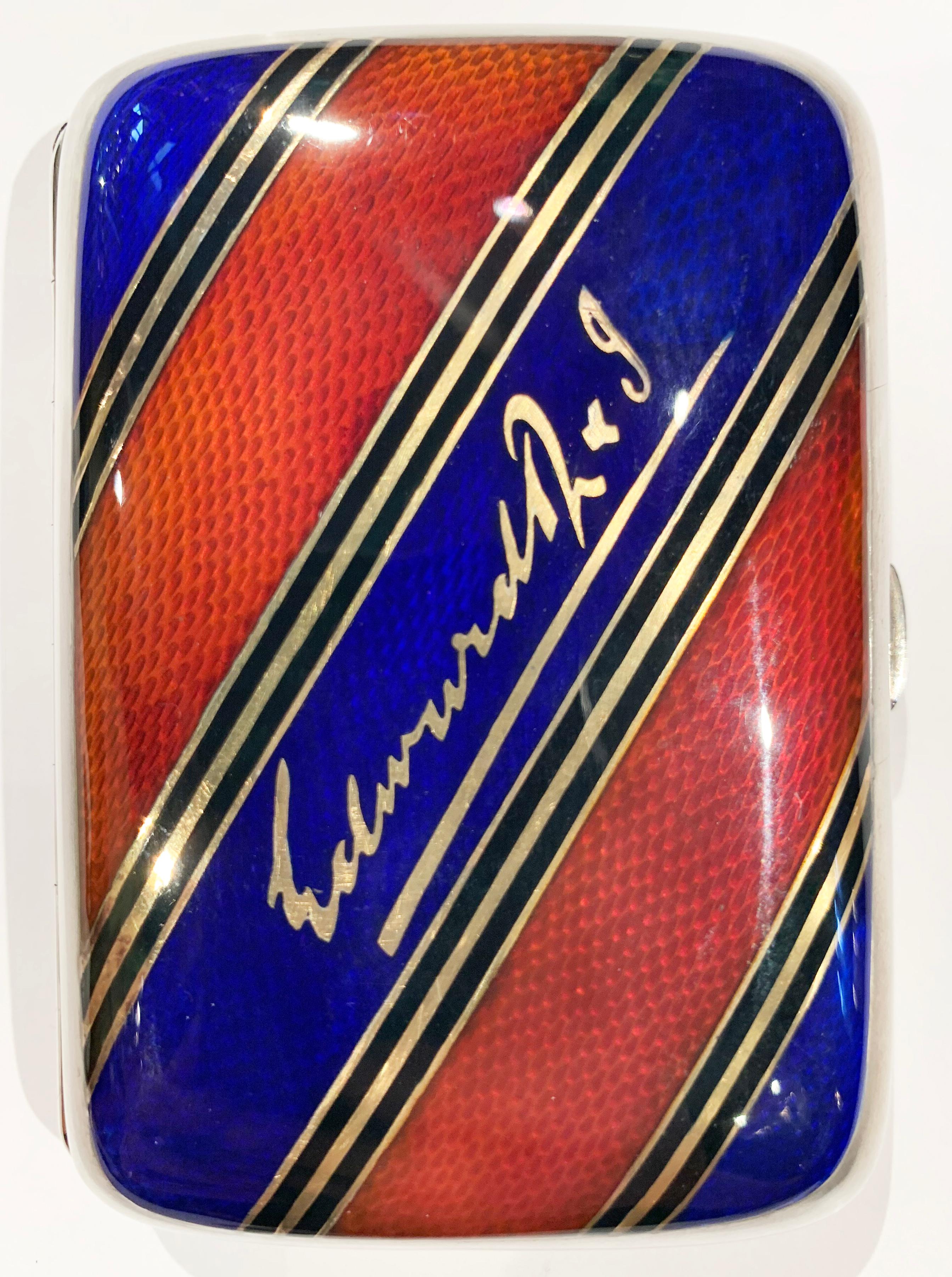 A stunning Edwardian cigarette case, formerly the property of HRH King Edward VII.

Made by Alexander Clarke of 33 New Bond Street in 1904.

With sumptuous royal red and royal navy blue guilloche enamel design, decorative gold striping and bearing