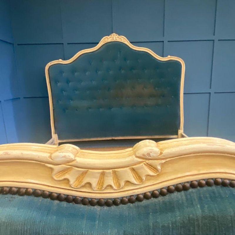 King size (5’ wide) antique French upholstered bed with a pretty shaped head board and a curved foot end. Circa 1920. Awaiting restoration.

The price indicated includes a full restoration of the bed frame. This involves repainting or polishing the