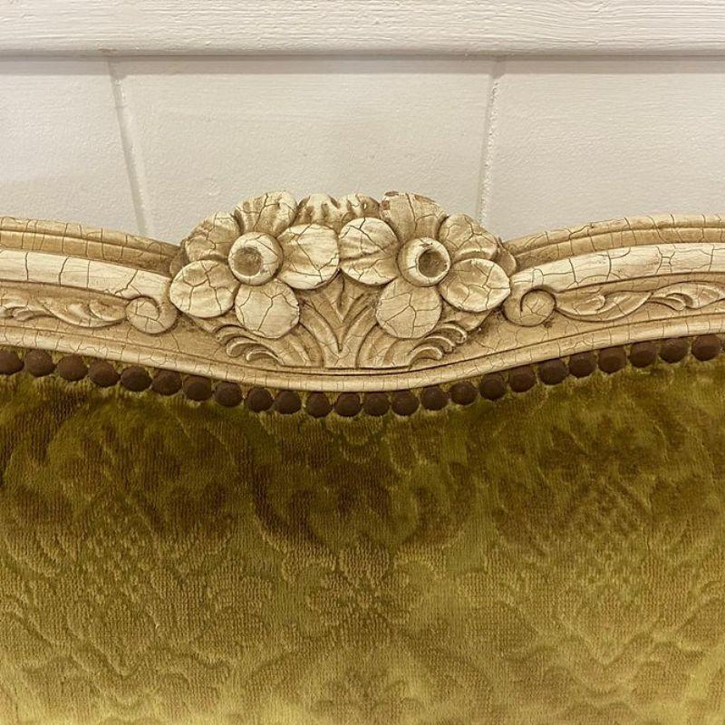 Antique king size French upholstered bed awaiting full restoration. This is a good frame and the bed has the very pretty curved foot end.

The restoration includes removal of the old studs, removal of the old fabric, painting or staining of the